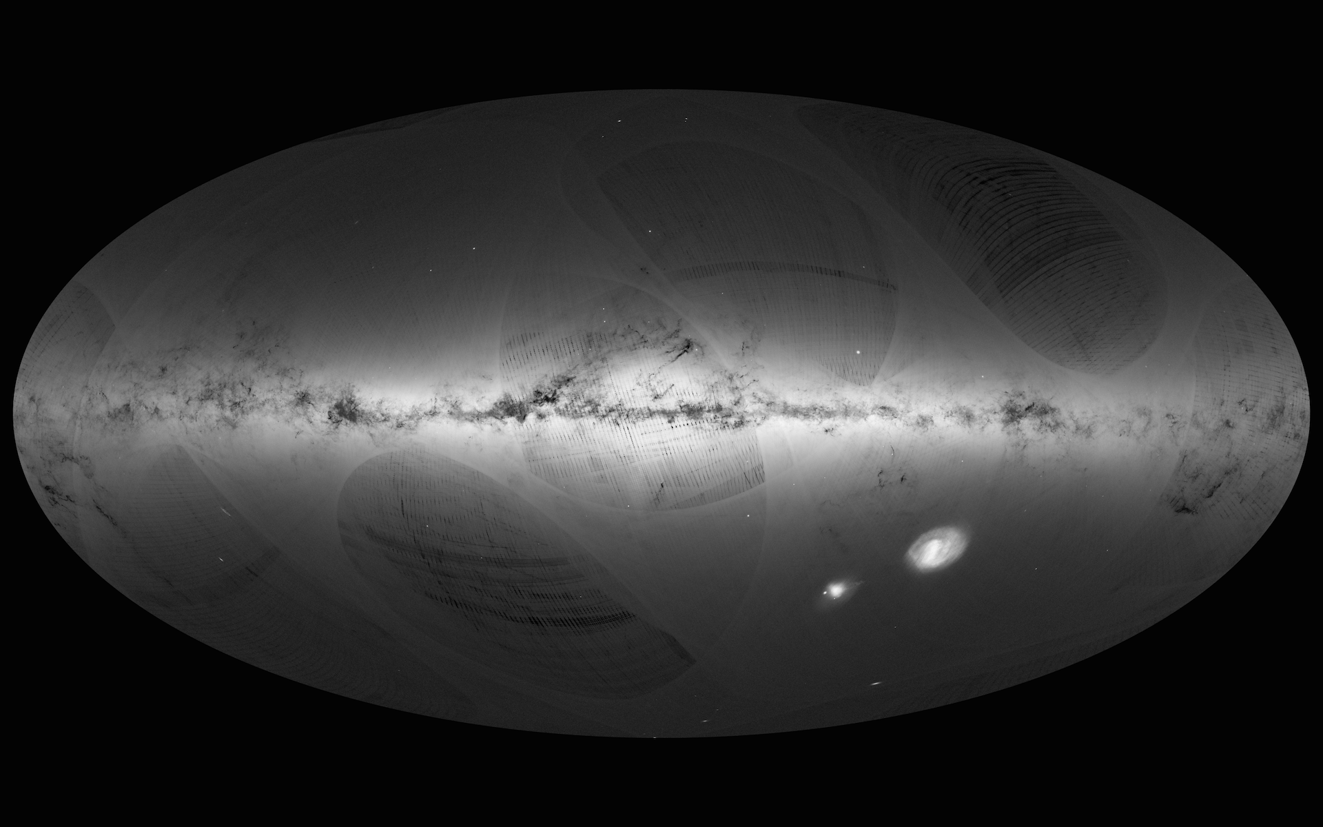 An all-sky view of stars in our Galaxy – the Milky Way – and neighbouring galaxies, based on the first year of observations from ESA’s Gaia satellite, from July 2014 to September 2015. This map shows the density of stars observed by Gaia in each portion of the sky. Brighter regions indicate denser concentrations of stars, while darker regions correspond to patches of the sky where fewer stars are observed. The Milky Way is a spiral galaxy, with most of its stars residing in a disc about 100 000 light-years across and about 1000 light-years thick. This structure is visible in the sky as the Galactic Plane – the brightest portion of this image –which runs horizontally and is especially bright at the centre. Image credit: ESA/Gaia/DPAC