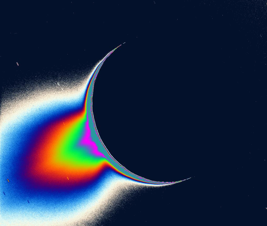Recent Cassini images of Saturn's moon Enceladus backlit by the sun show the fountain-like sources of the fine spray of material that towers over the south polar region. The image was taken looking more or less broadside at the "tiger stripe" fractures observed in earlier Enceladus images. It shows discrete plumes of a variety of apparent sizes above the limb of the moon. The greatly enhanced and colorized image shows the enormous extent of the fainter, larger-scale component of the plume. Imaging scientists, as reported in the journal Science on March 10, 2006, believe that the jets are geysers erupting from pressurized subsurface reservoirs of liquid water above 273 degrees Kelvin (0 degrees Celsius). Credit: NASA/JPL/Space Science Institute