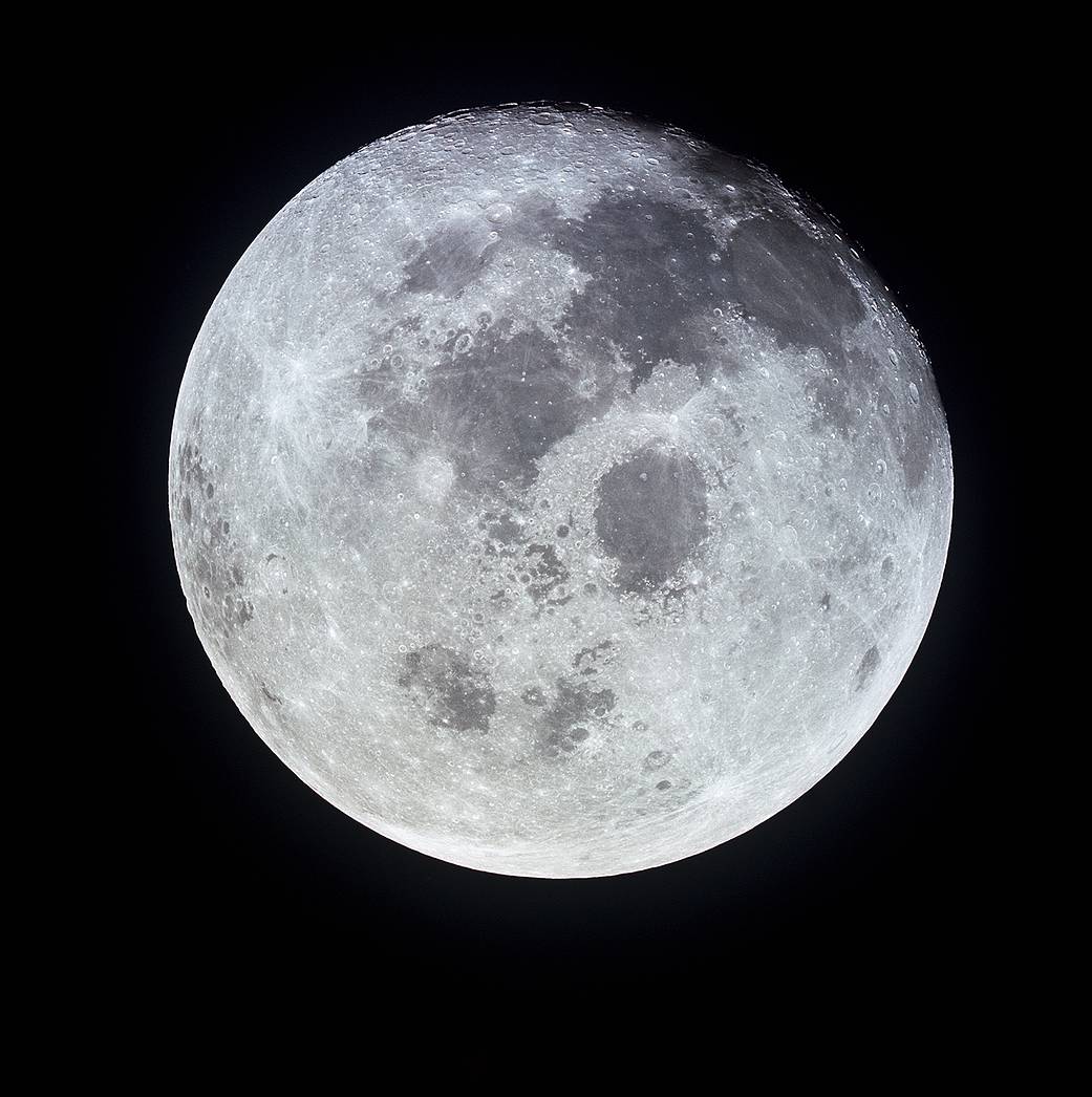 This outstanding view of the full moon was photographed from the Apollo 11 spacecraft during its trans-Earth journey homeward. When this picture was taken, the spacecraft was already 10,000 nautical miles away. On board Apollo 11 were commander Neil Armstrong, command module pilot Michael Collins and lunar module pilot Buzz Aldrin. While astronauts Armstrong and Aldrin descended in the lunar module Eagle to explore the moon, Collins remained on the command and service module Columbia in lunar orbit. Image Credit: NASA