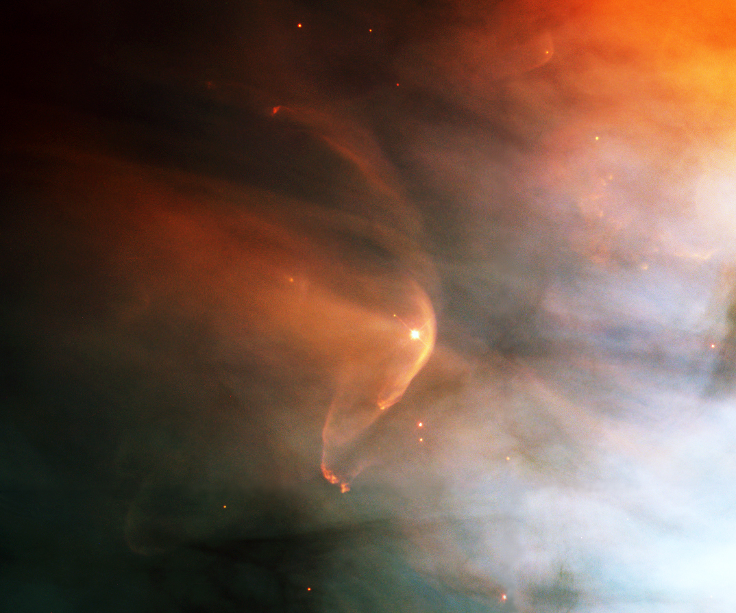 The Hubble Space Telescope imaged this view in February 1995. The arcing, graceful structure is actually a bow shock about half a light-year across, created from the wind from the star L.L. Orionis colliding with the Orion Nebula flow. Image Credit: NASA