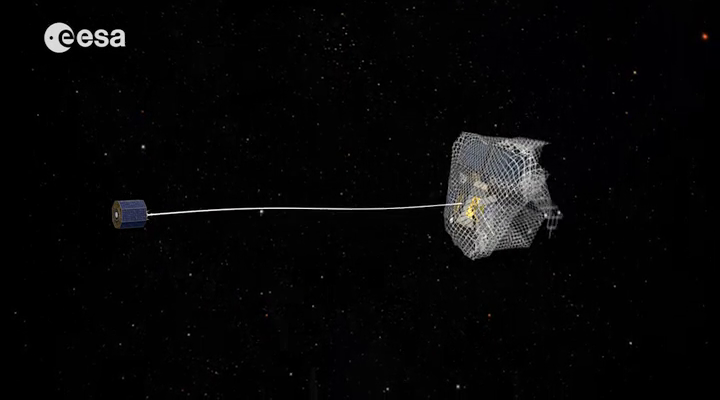 One capture concept being explored through ESA's e.Deorbit system study for Active Debris Removal - capturing the satellite in a net attached to either a flexible tether (as seen here) or a rigid connection. Image credit: ESA