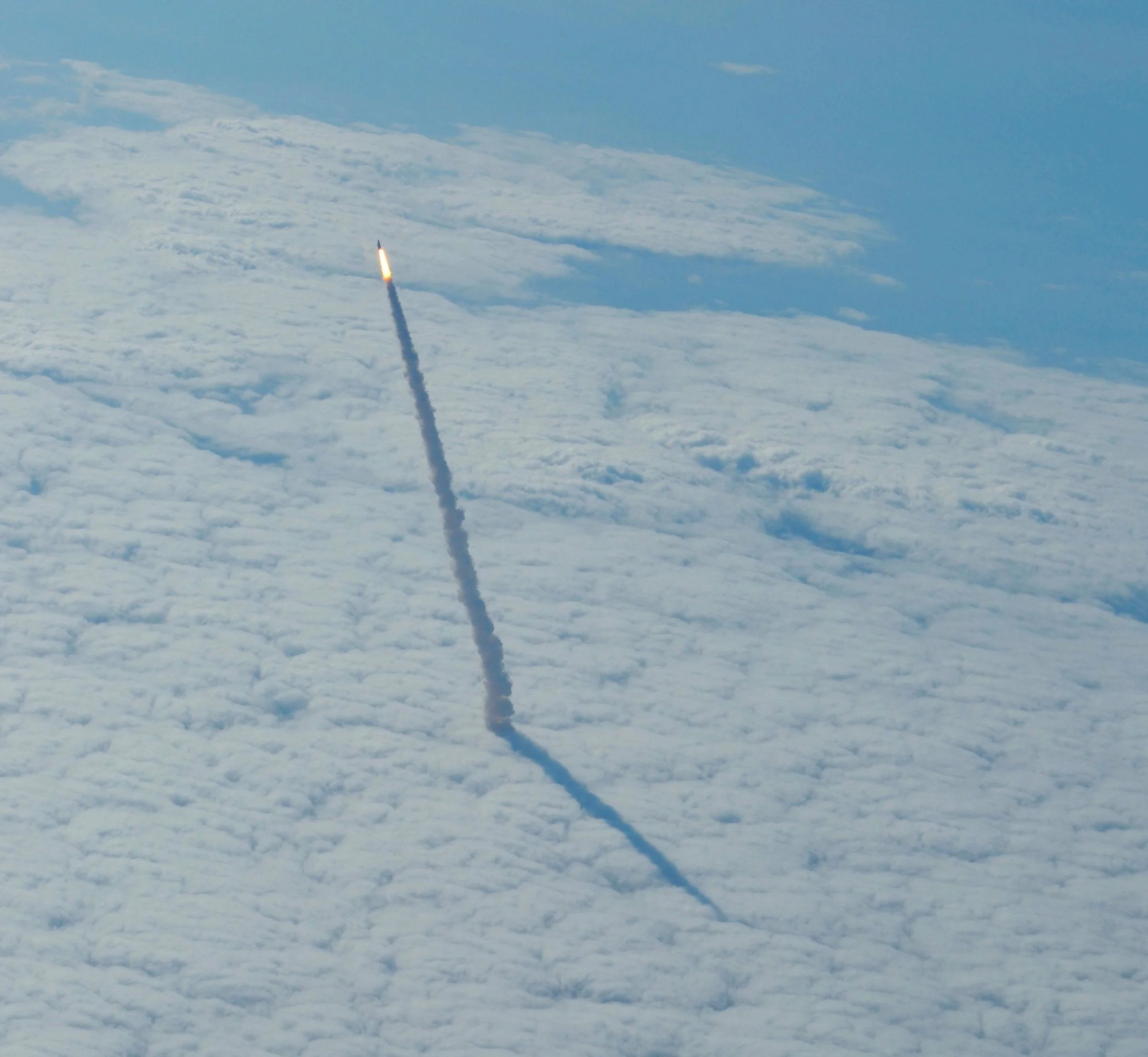Photographed from a shuttle training aircraft, space shuttle Endeavour and its six-member STS-134 crew head toward Earth orbit and rendezvous with the International Space Station. Liftoff was at 8:56 a.m. (EDT) on May 16, 2011, from Launch Pad 39A at NASA's Kennedy Space Center. Onboard are NASA astronauts Mark Kelly, commander; Greg H. Johnson, pilot; Michael Fincke, Andrew Feustel, Greg Chamitoff and European Space Agency astronaut Roberto Vittori, all mission specialists. STS-134 will deliver the Alpha Magnetic Spectrometer-2 (AMS), Express Logistics Carrier-3, a high-pressure gas tank and additional spare parts for the Dextre robotic helper to the International Space Station. STS-134 is the final spaceflight for Endeavour. Image credit: NASA