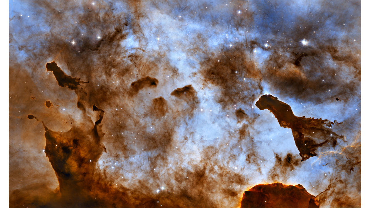 These one-light-year-tall pillars of cold hydrogen and dust, imaged by the Hubble Space Telescope, are located in the Carina Nebula. This image of dust pillars in the Carina Nebula is a composite of 2005 observations taken of the region in hydrogen light (light emitted by hydrogen atoms) along with 2010 observations taken in oxygen light (light emitted by oxygen atoms), both times with Hubble's Advanced Camera for Surveys. The immense Carina Nebula is an estimated 7,500 light-years away in the southern constellation Carina. NASA, ESA, and the Hubble Heritage Project (STScI/AURA); Acknowledgment: M. Livio (STScI) and N. Smith (University of California, Berkeley)