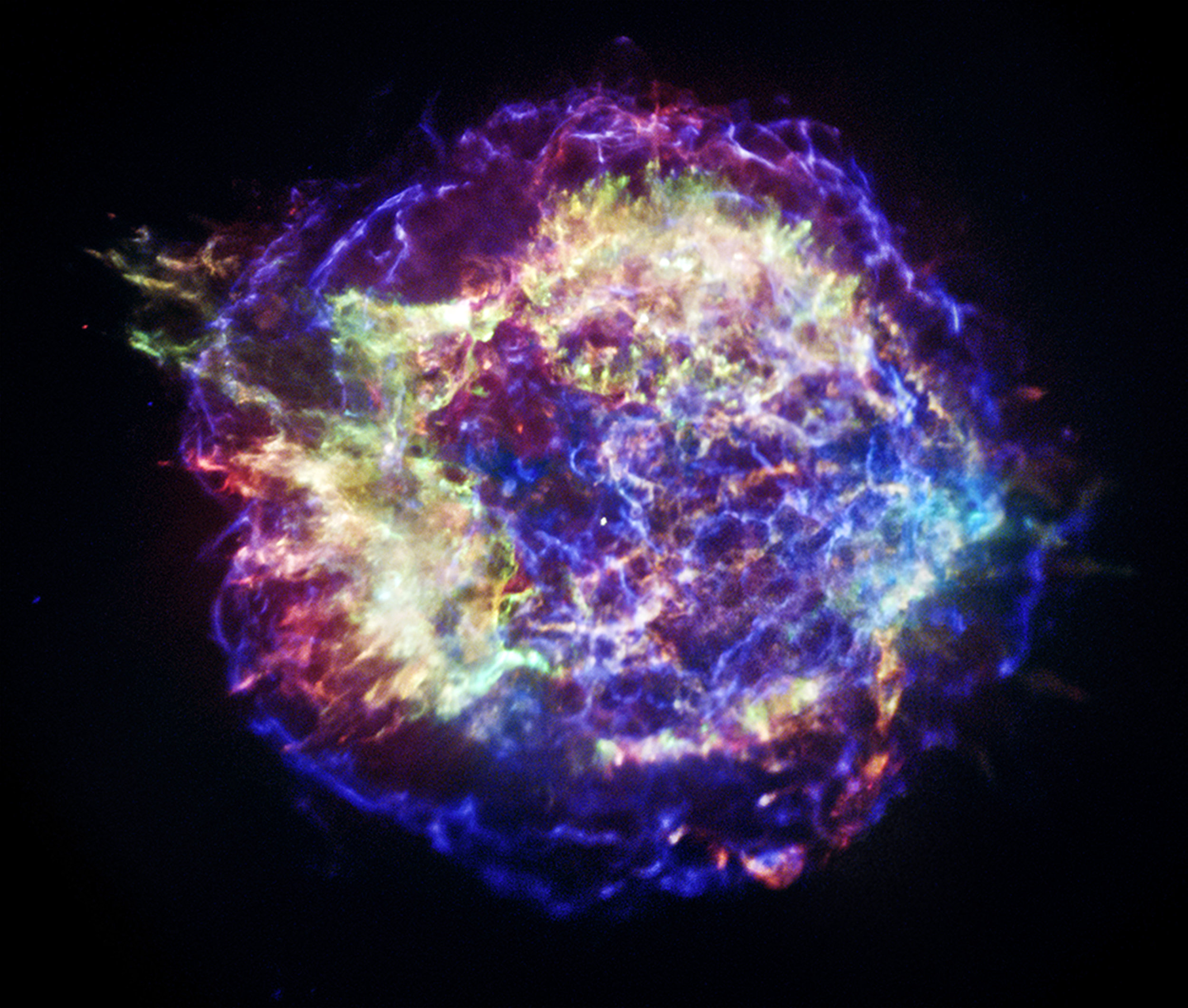 This new version of Chandra's image of the Cassiopeia A supernova remnant has been specially processed to show with better clarity the appearance of Cas A in different bands of X-rays. This will aid astronomers in their efforts to reconstruct details of the supernova process such as the size of the star, its chemical makeup, and the explosion mechanism. The color scheme used in this image is the following: low-energy X-rays are red, medium-energy ones are green, and the highest-energy X-rays detected by Chandra are colored blue. Image Credit: NASA/CXC/SAO.