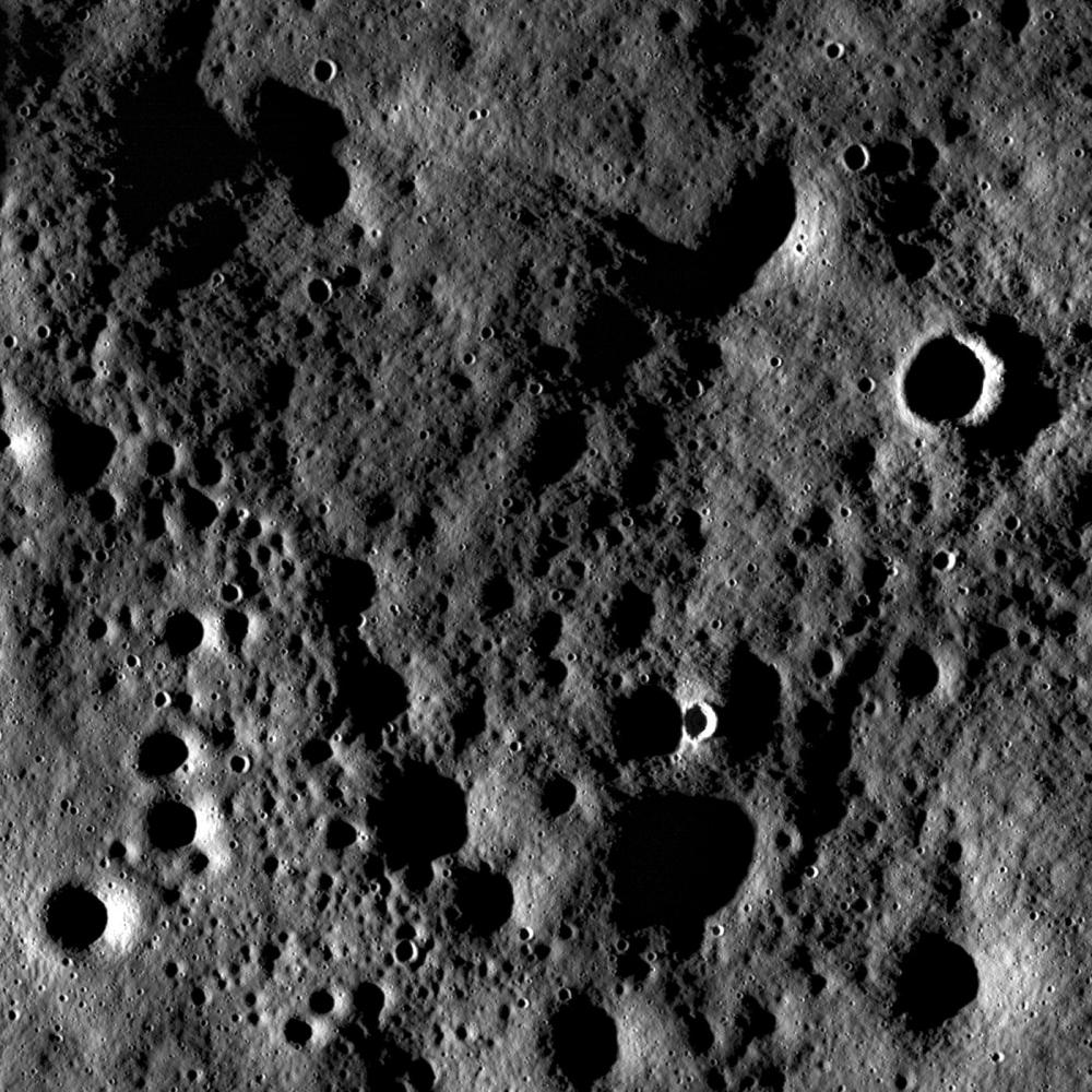 Rugged highland terrain on the farside of the Moon, south of Cantor crater, taken at sunset. Image width is ~3.4 kilometers. Although the pronounced shadows hide the interiors of craters, the high incidence angle exaggerates the surrounding terrain so that subtle surface features are enhanced. Image credit: NASA/GSFC/Arizona State University