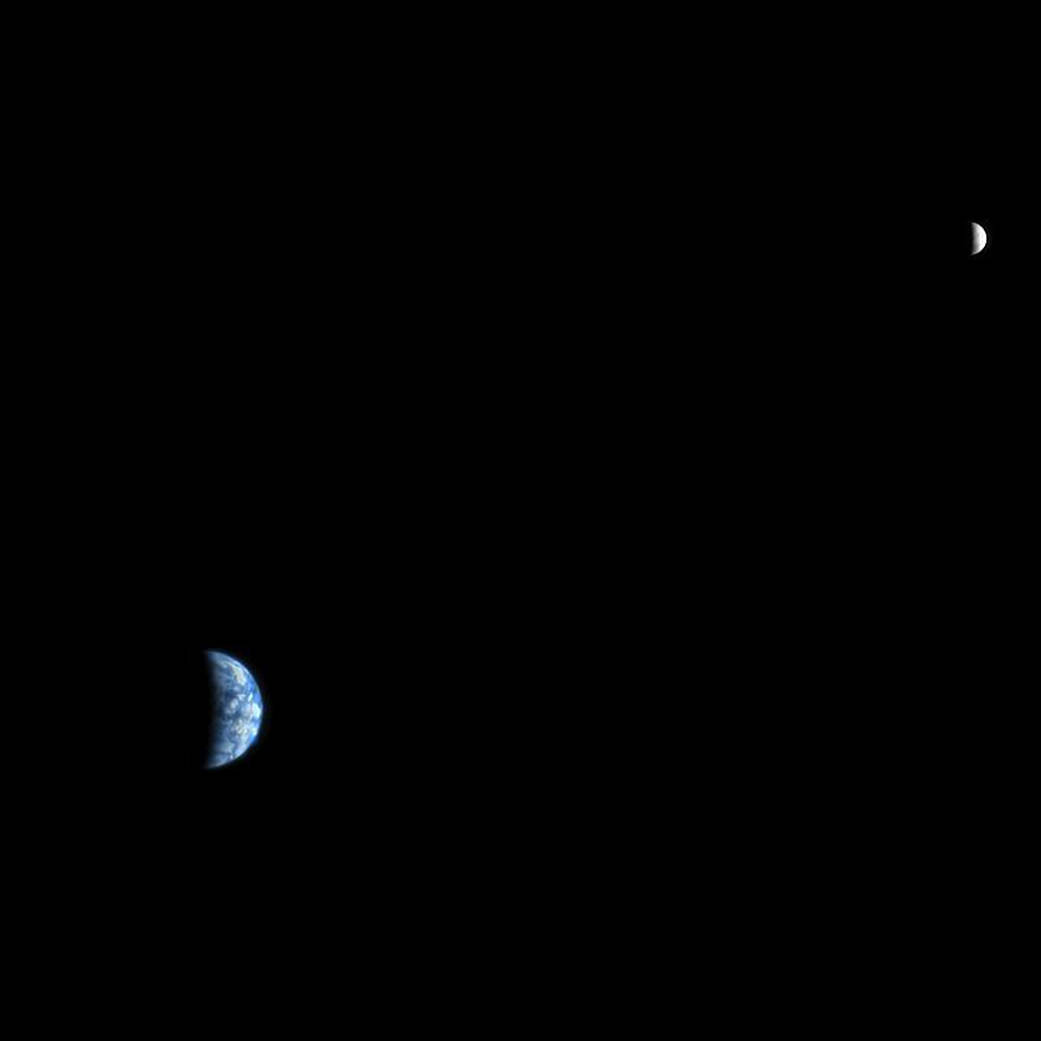 This is an image of Earth and the moon, acquired on October 3, 2007, by the HiRISE camera on NASA's Mars Reconnaissance Orbiter. At the time the image was taken, Earth was 142 million kilometers (88 million miles) from Mars, giving the HiRISE image a scale of 142 kilometers (88 miles) per pixel. The moon image is brightened relative to Earth for this composite. Image credit: NASA/JPL-Caltech/University of Arizona