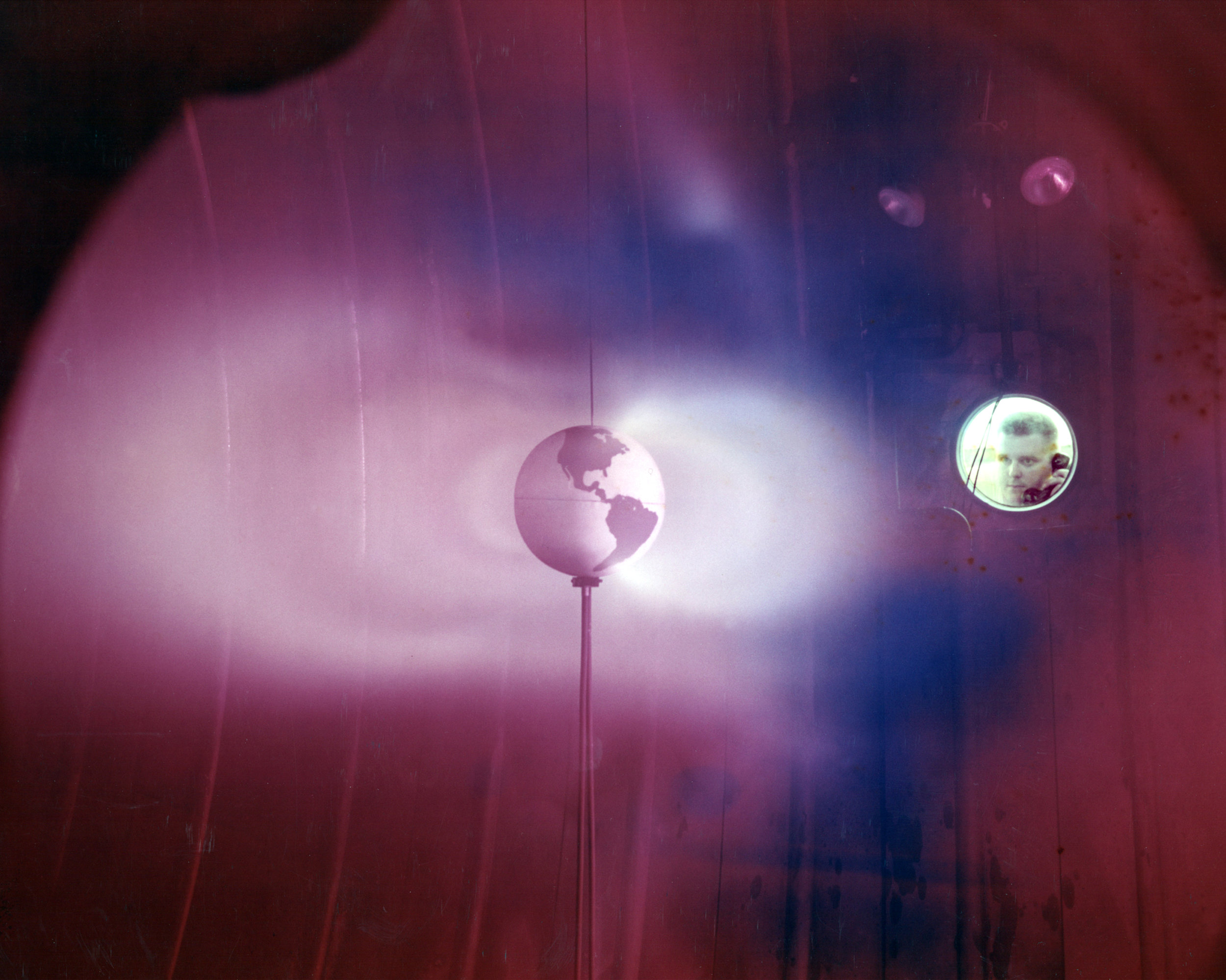In this 1966 photo, a plasma thruster at NASA's Lewis Research Center simulates Van Allen Belts, rings of radiation around the Earth. The Cleveland, Ohio, center is now John H. Glenn Research Center. Image credit: NASA