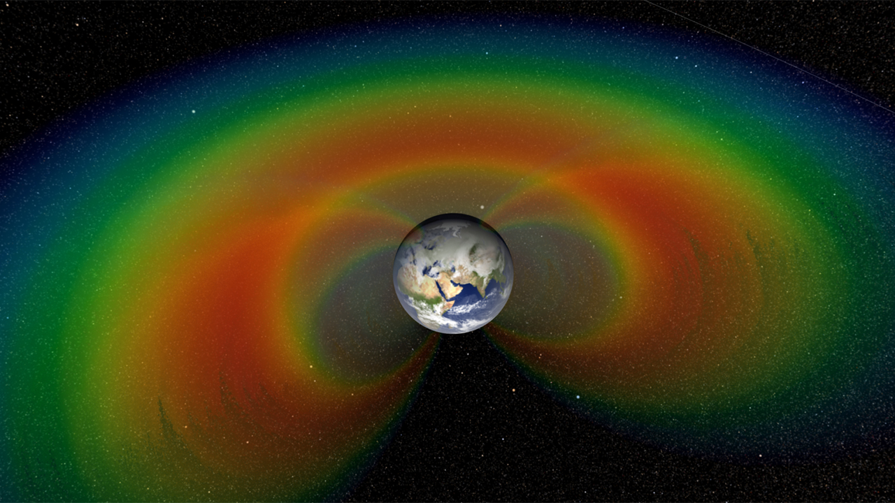 An artist's depiction with cutaway section of the two giant donuts of radiation, called the Van Allen Belts, that surround Earth. Image credit: NASA/Goddard Space Flight Center/Scientific Visualization Studio