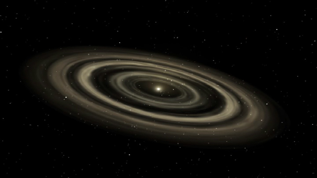 Planet formation begins with a brilliant young star at the center of what’s called a protoplanetary disk. Collisions within the disk form rocks that act as planetary building blocks. They settle into orbit around the star, creating gaps in the disk. Image credit: NASA's Goddard Space Flight Center Video and images courtesy of NASA/JPL-Caltech