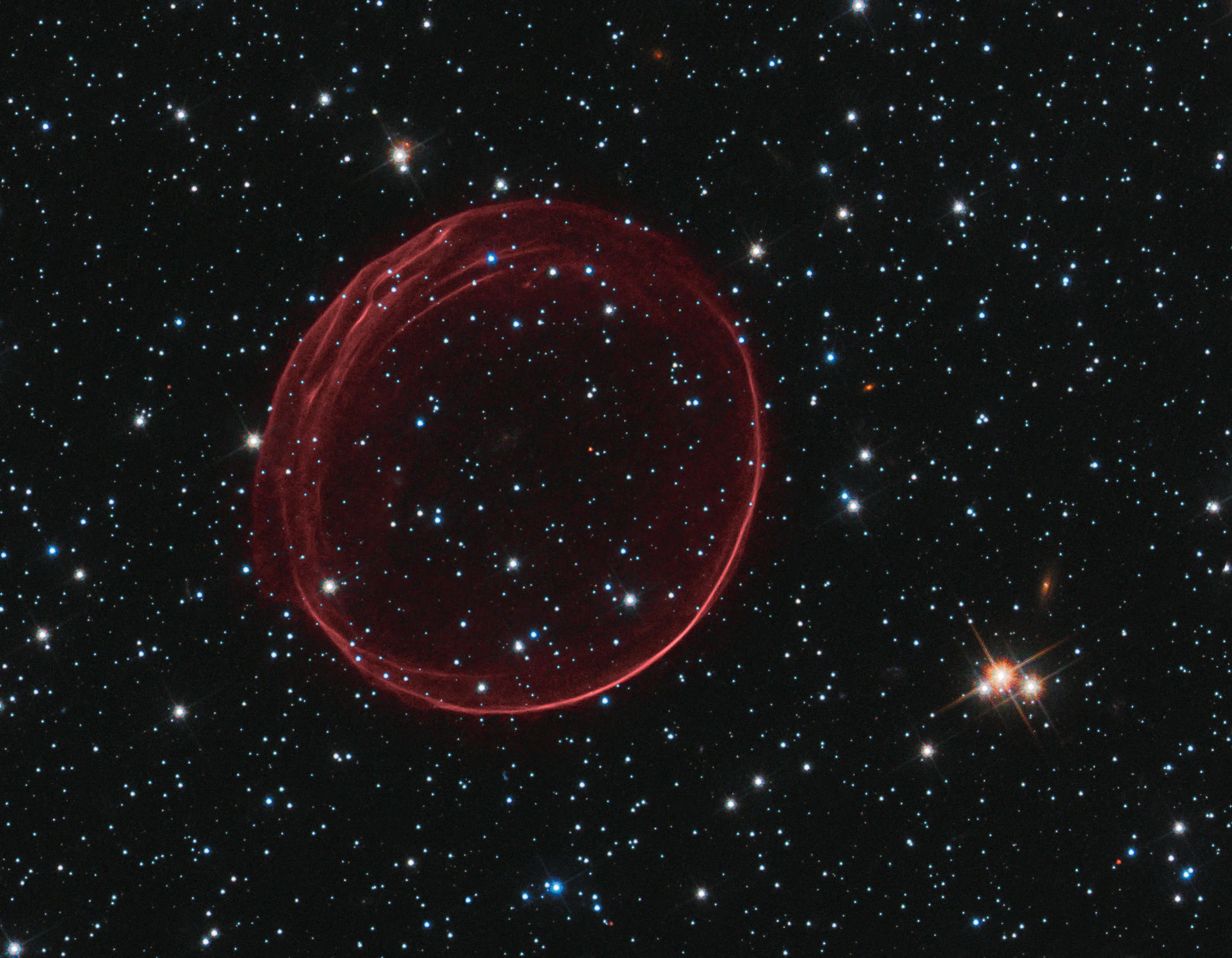 A delicate sphere of gas, photographed by NASA's Hubble Space Telescope, floats serenely in the depths of space. The pristine shell, or bubble, is the result of gas that is being shocked by the expanding blast wave from a supernova. Image credit: NASA , ESA , and the Hubble Heritage Team ( STScI / AURA ); Acknowledgment: J. Hughes (Rutgers University)