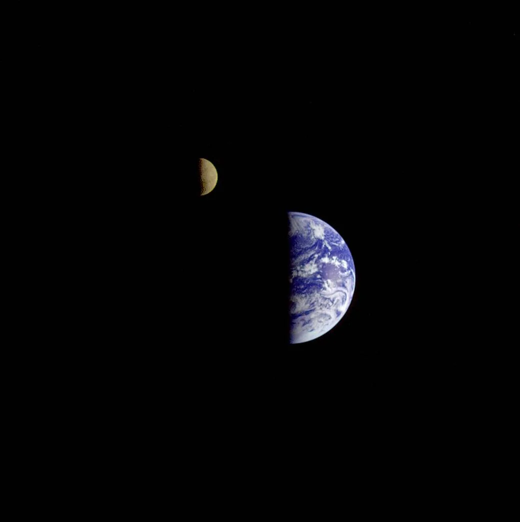 This picture of the Earth and Moon in a single frame was taken by the Galileo spacecraft from about 3.9 million miles away. Antarctica is visible through clouds (bottom). The Moon's far side is seen. Image credit: NASA