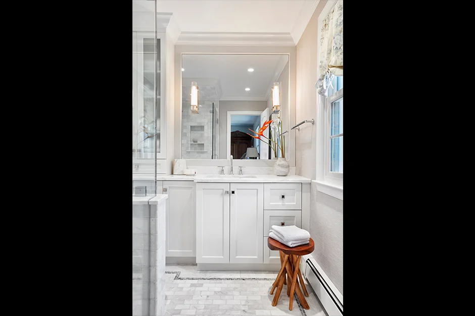 By changing out the enclosed shower wall for glass, Giselle immediately opened up the bath to more light and space.