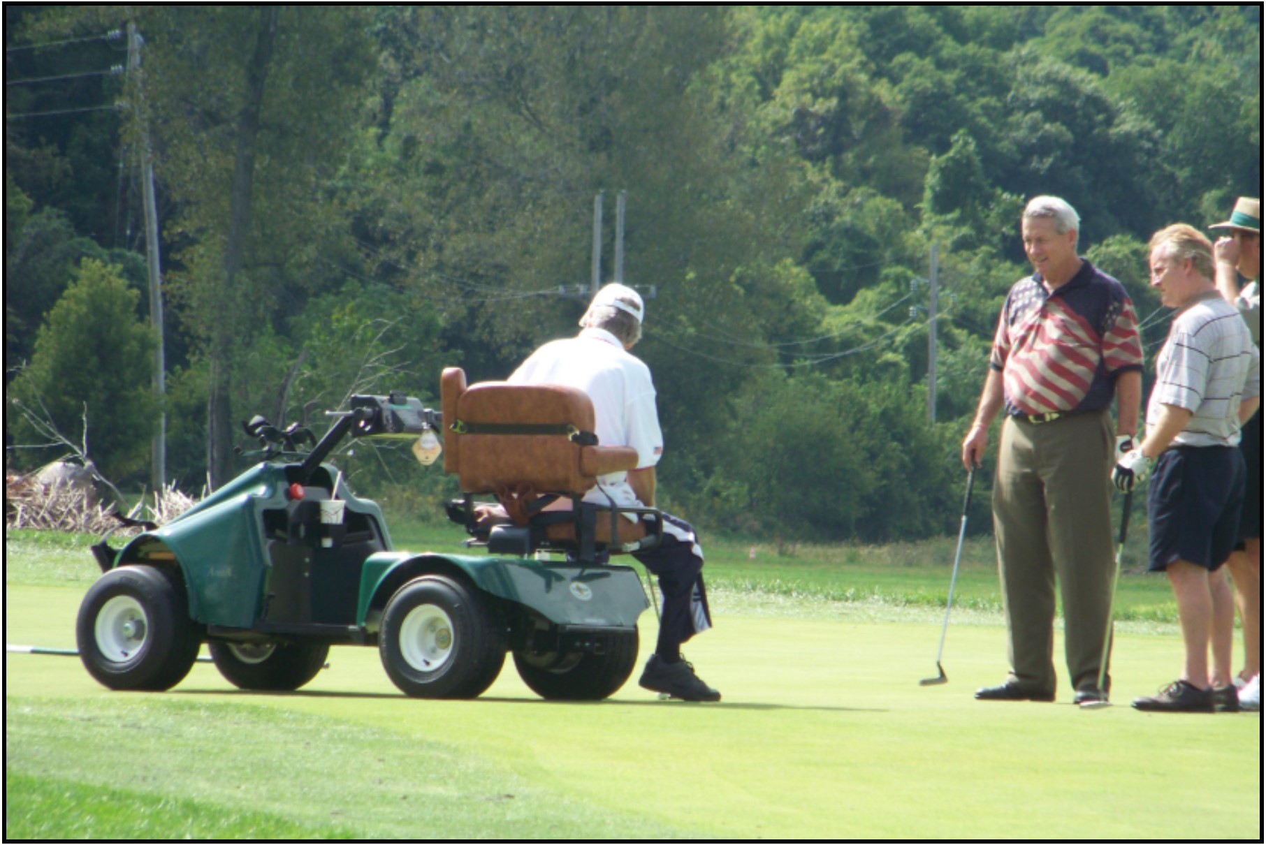 Accessible golf cart - Dennis putts.jpg