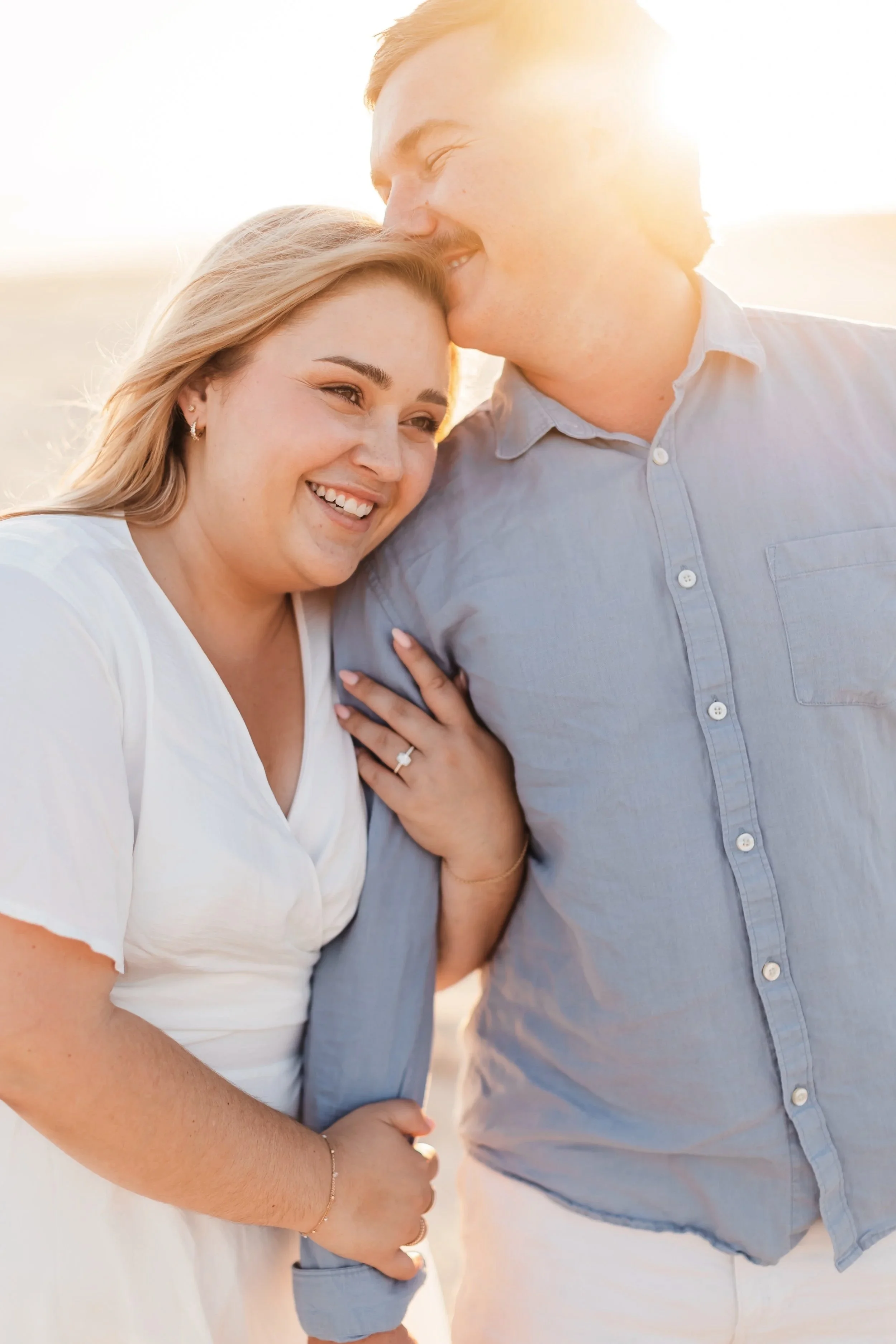 Couple on the beach at golden hour