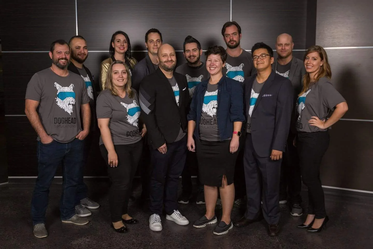 The Doghead Simulations team. Back row, left to right: Tony Dodge, Amber Osborne, Rusty Sempsrott, Will Fitzgerald, Chance Glasco, James Wagar. Front row, left to right: Justin Gallo, Amanda Sanchez, Mat Chacon, Lily Snyder, Elbert Perez, Amanda Sweaton. Not shown: Brian Traficante and Diego Maia.