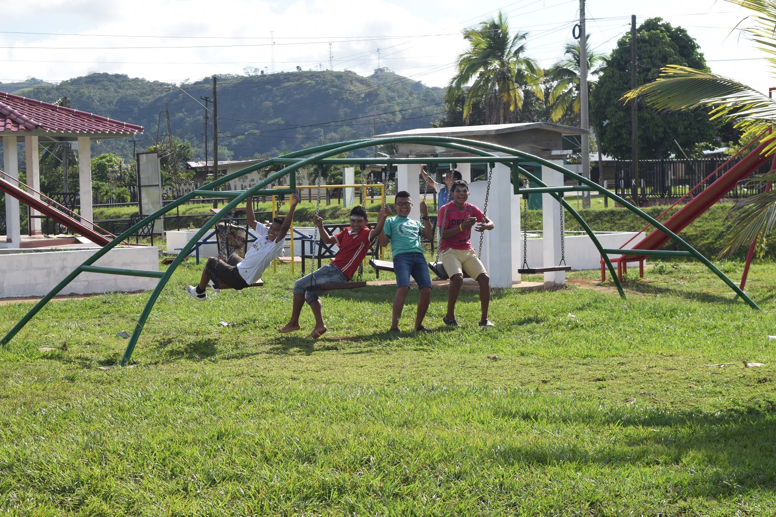Youth from Quebrada Honda relaxing in the park across the street between sessions during Panama Camp 2018.