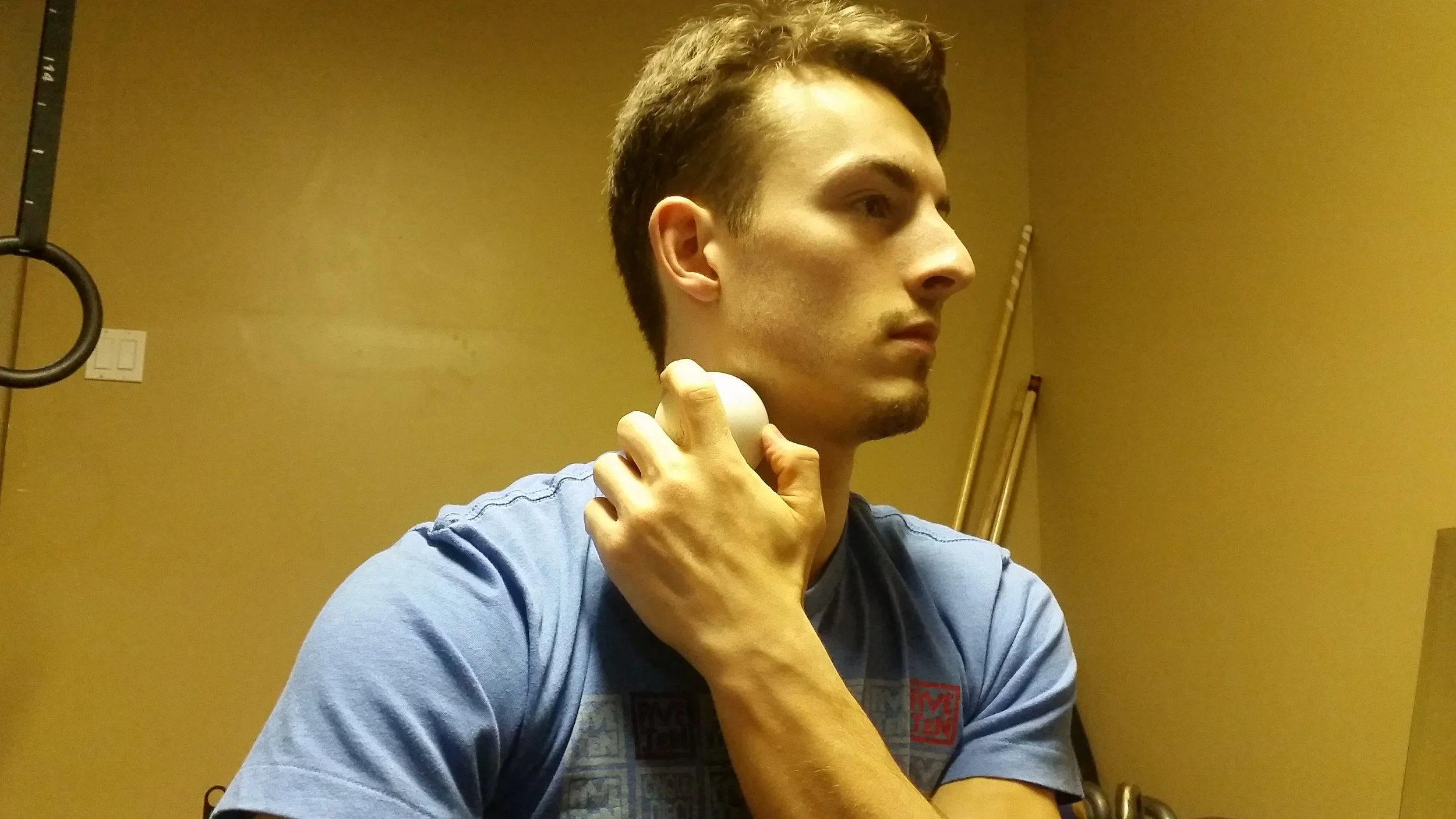 Place LAX ball on your neck, just beneath jaw