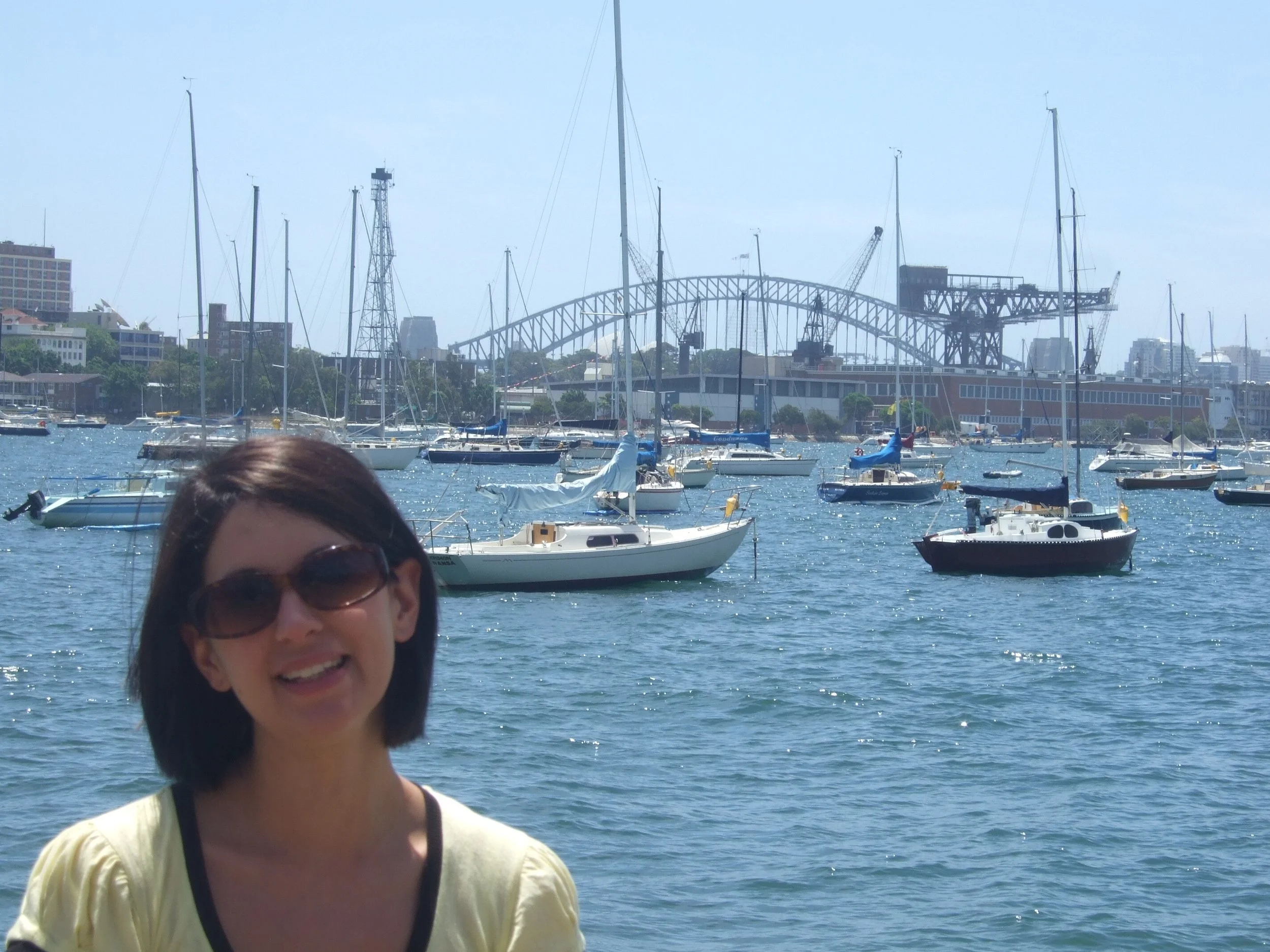 24 year old woman with background of Sydney harbour