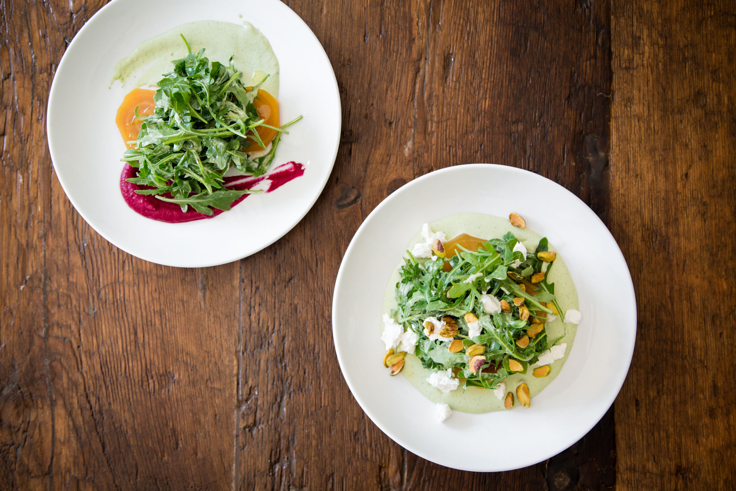 Roasted Golden Beets with Goat Cheese, Hearty Greens, Green Goddess Dressing, and Crushed Pistachios