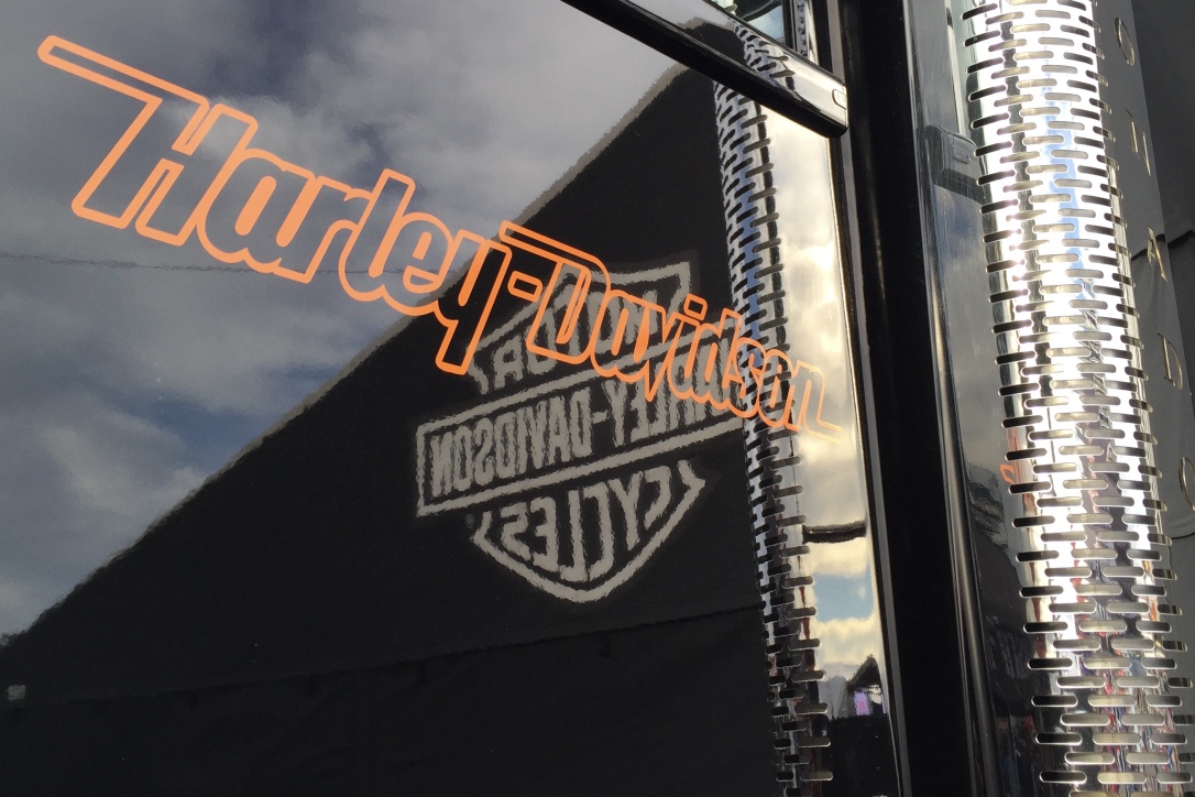 Pictured: The glossy black and chrome of one of Harley Davidson's truck fleet.