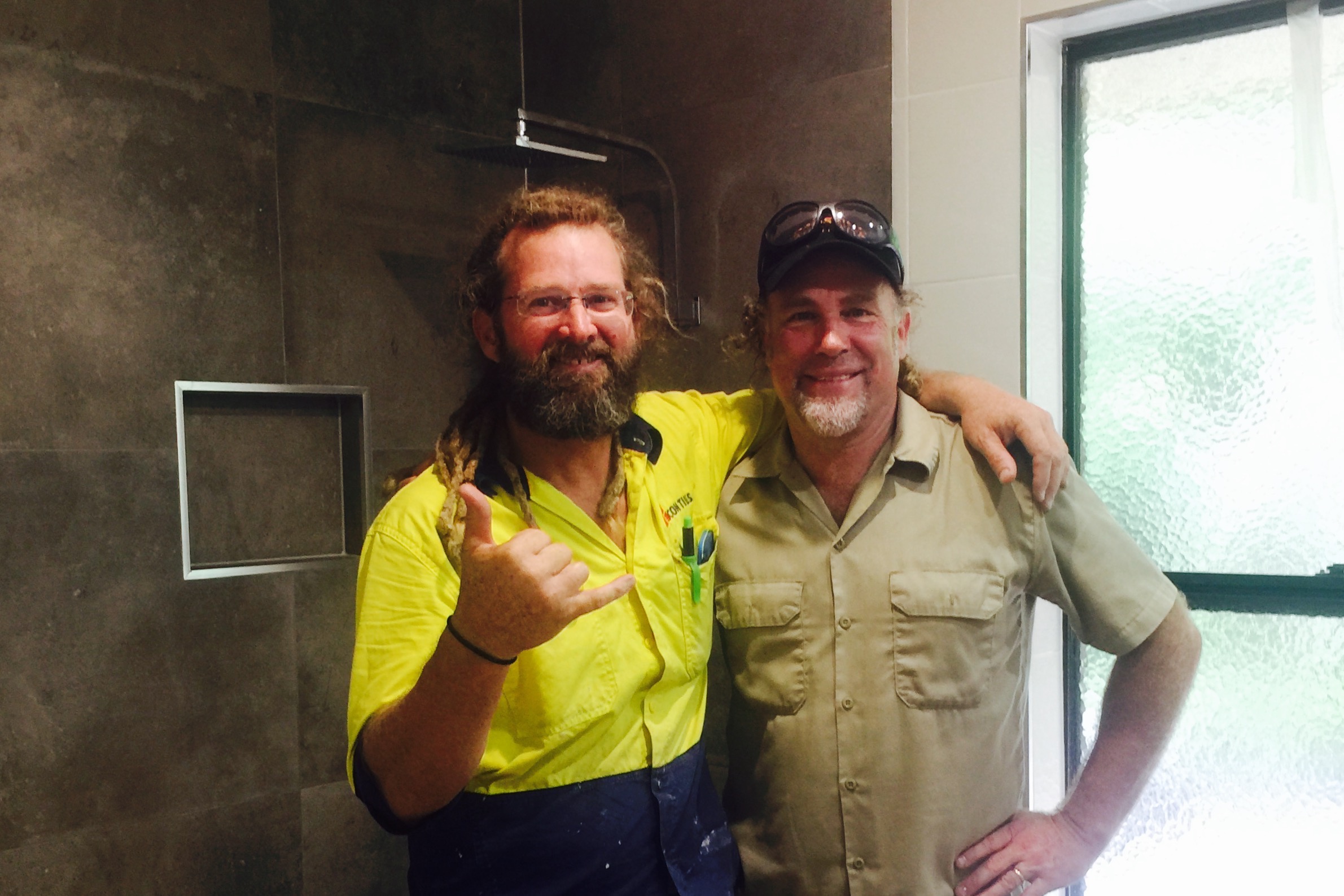 Pictured: Dave Ison with Steve and the beautifully renovated bathroom at home.