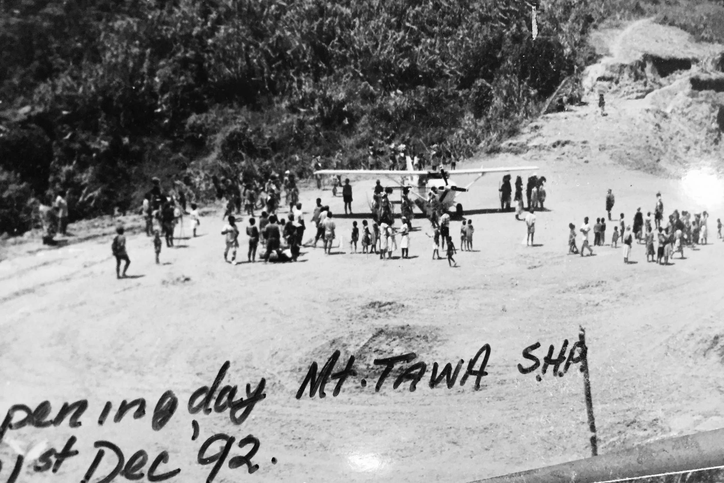 Pictured: The official opening of the Mt Tawa airstrip in the Southern Highlands of PNG. With a successful landing of a Cessna 206 to celebrate with the remote tribal group.