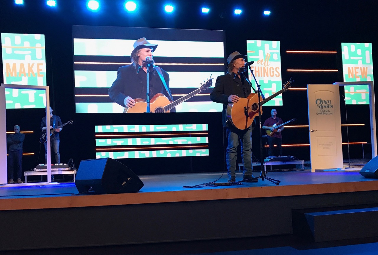 Pictured: Steve sharing songs and encouraging people to mission at Wave Church.