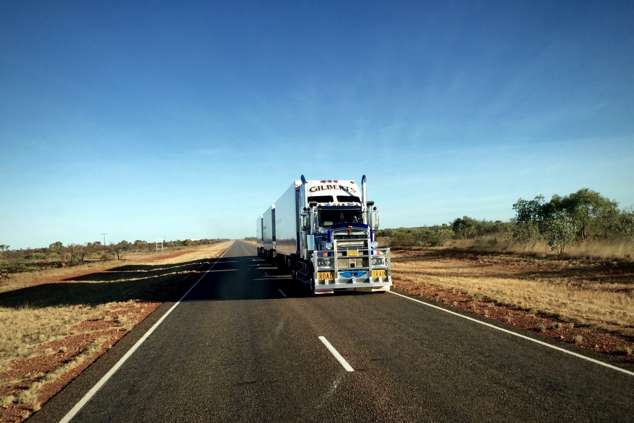 Pictured: A long nose Kenworth triple trailer Road Train heading south on Australia's only inland north/south road towards Alice Springs, NTl