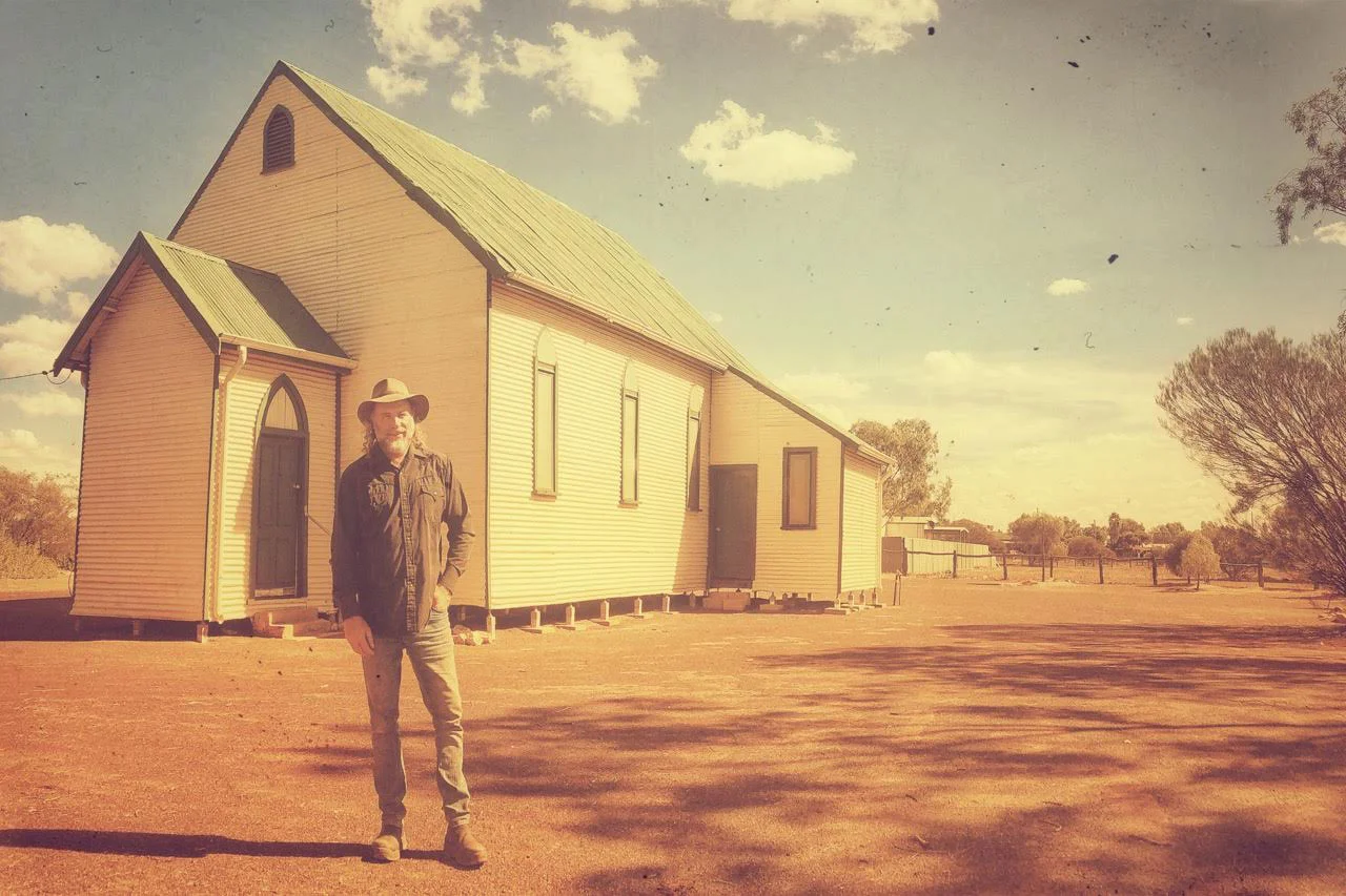 Pictured: Steve outside a historic church in a town called Sandstone, Western Australia