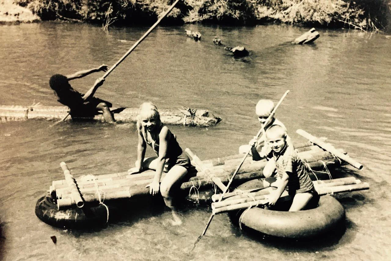 Pictured: The Grace kids on their maiden voyage aboard a newly constructed raft in Ukarumpa, Papua New Guinea, Circa 1968.