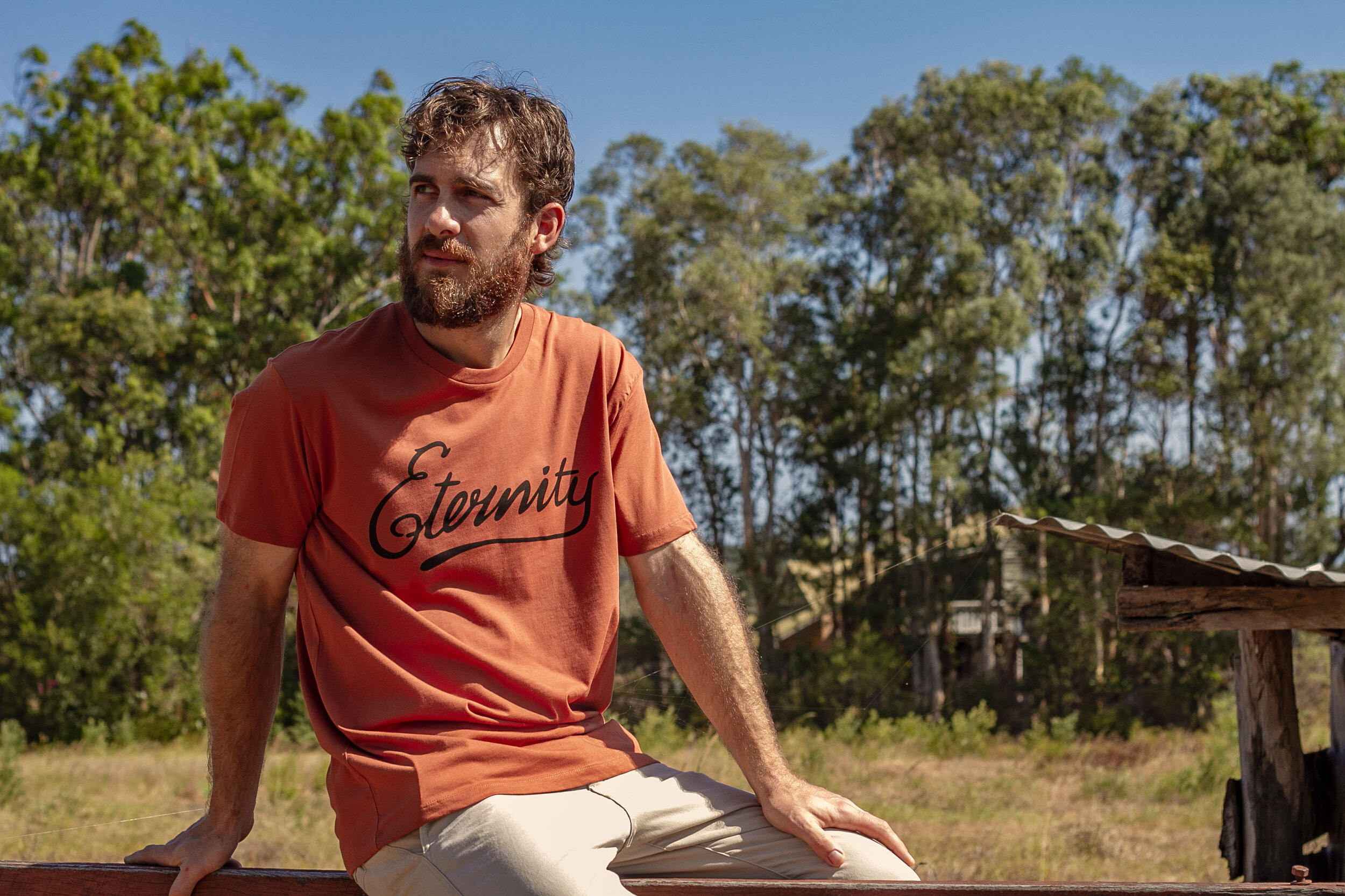 Eternity-Tee-Outback-Red-Model-Fence.jpg