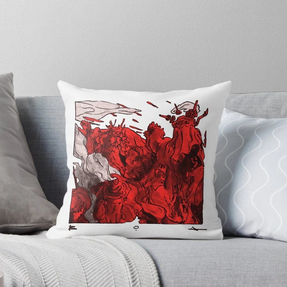 Decorative pillow with red and black abstract artwork of a chaotic scene with horned figures and faces on a white background, placed among other plain pillows on a gray couch.