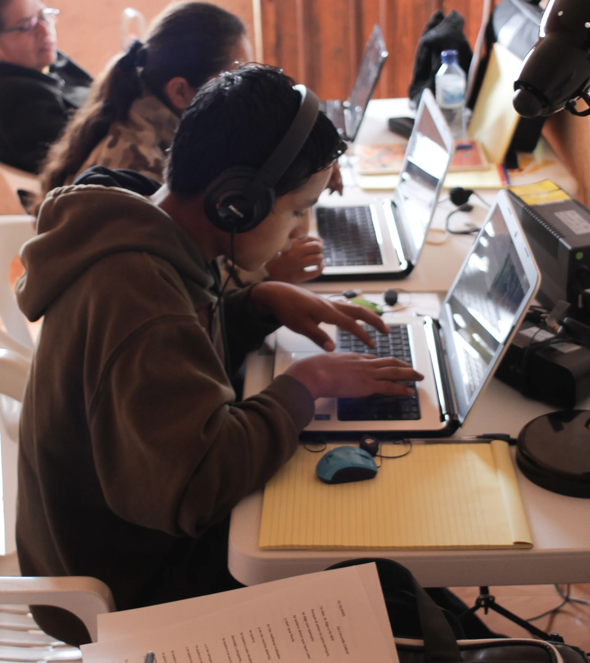 The Text Team at work transcribing and translating videos.