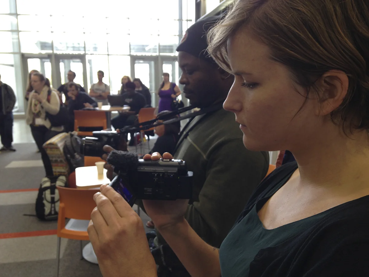 Video trainees at CoLang 2016, practice filming a cultural performance of Tlinglit singers at the University of Alaska, Fairbanks.