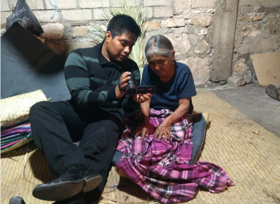 Ricardo Jiménez Jiménez, from San Pedro Jaltepetongo, Cuicatlán, Oaxaca, shows his video footage to a community participant.