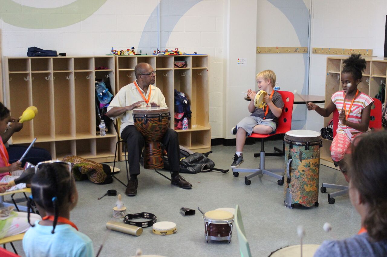 Music Director, Bro Ah giving a music class.