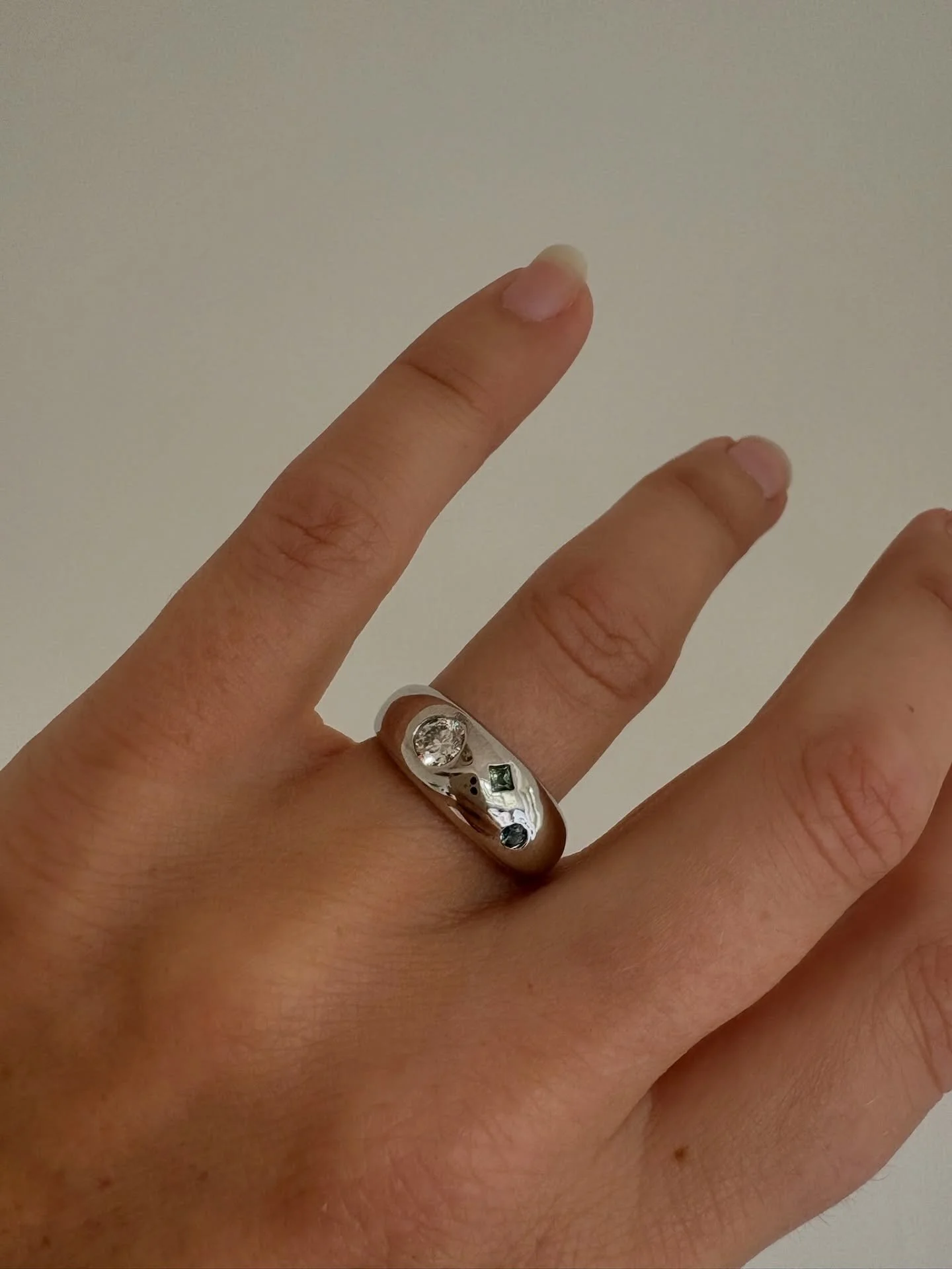 Such a special bespoke Cloud Signet, designed as an engagement ring for Ella by her lovely fianc&eacute;e, Ruari 🤍

This one-of-a-kind ring is set in platinum, and features an Ocean Diamond, as well as two beautiful fairmined Sapphires. On the insid