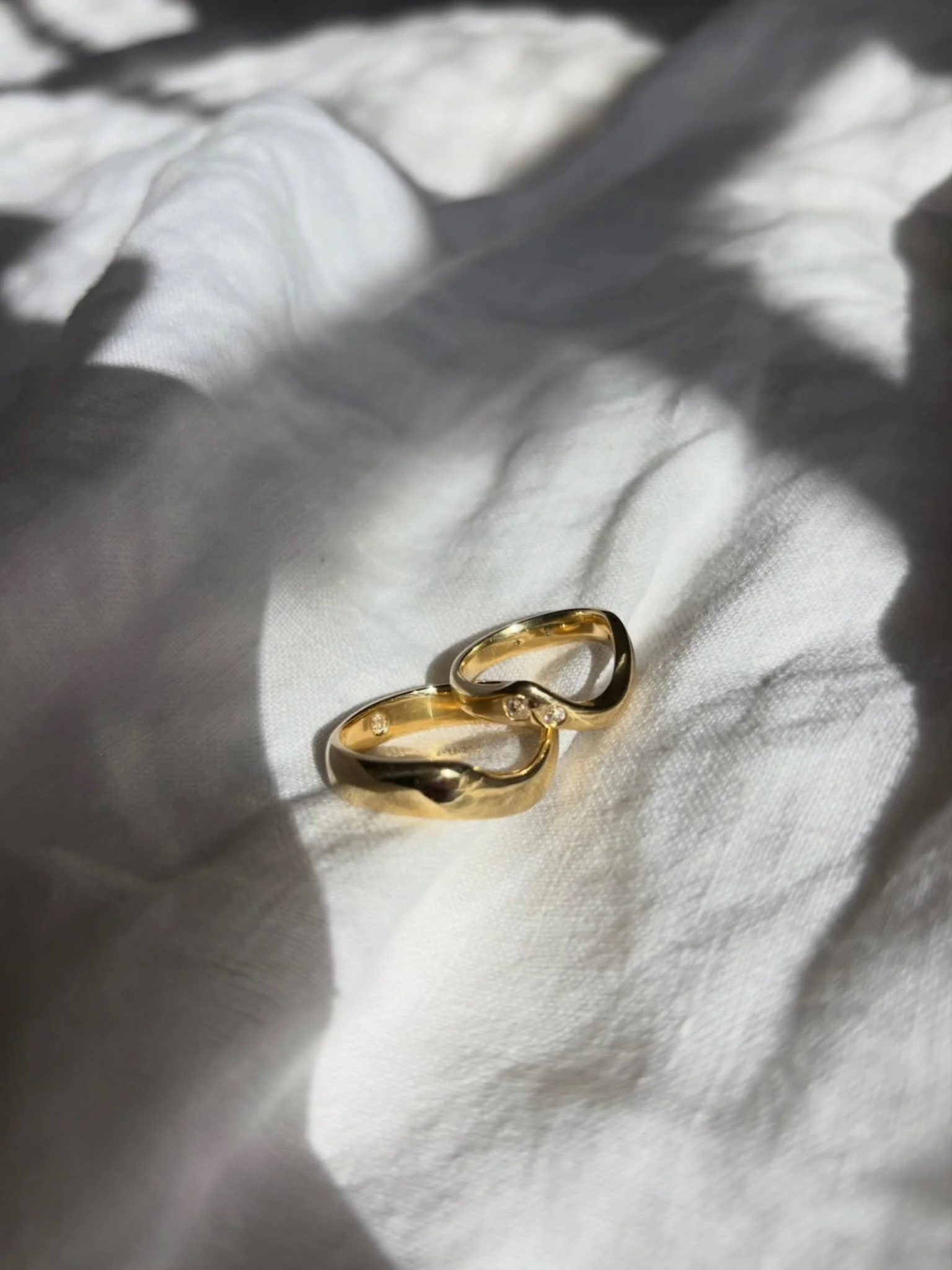 Two wedding rings with a little something hidden in each one 🤍

A wavy band scattered with diamonds that catch the light as it moves &mdash; and a second band with a secret diamond tucked inside, just for the person wearing it.