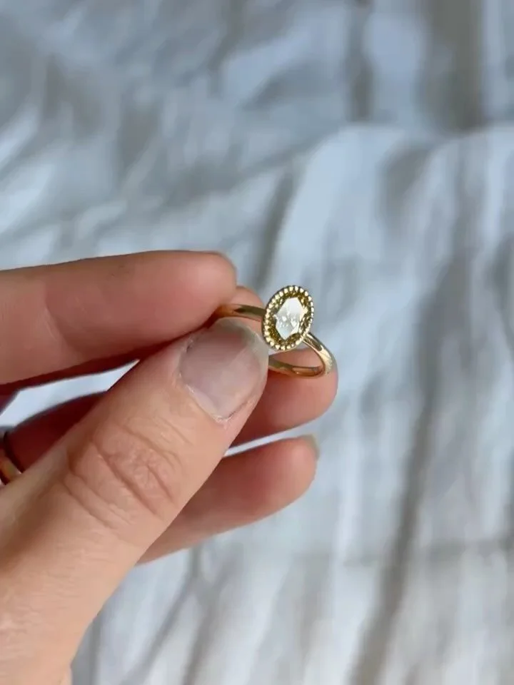 A nod to vintage charm 🤍

This beautiful oval champagne diamond has been set in a delicate milgrain surround and cast in 18ct Fairmined Gold. Bespoke and entirely beautiful.

Completely bespoke and unique to the wearer.

Design your dream ring with 