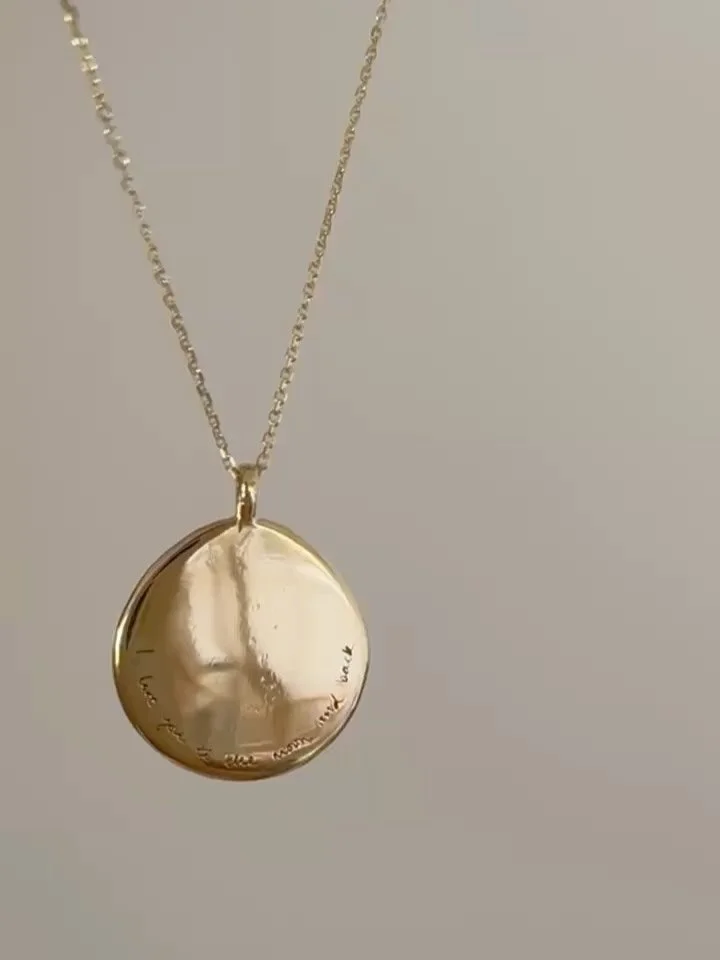 Our Full Moon Disc Necklace 🌕

Beautiful smooth on one side &mdash; perfect for engravings &mdash; and intricately hammered on the other. 

Make this piece extra personal with a hand written engraving or birthstone. 

Browse our fine collection onli