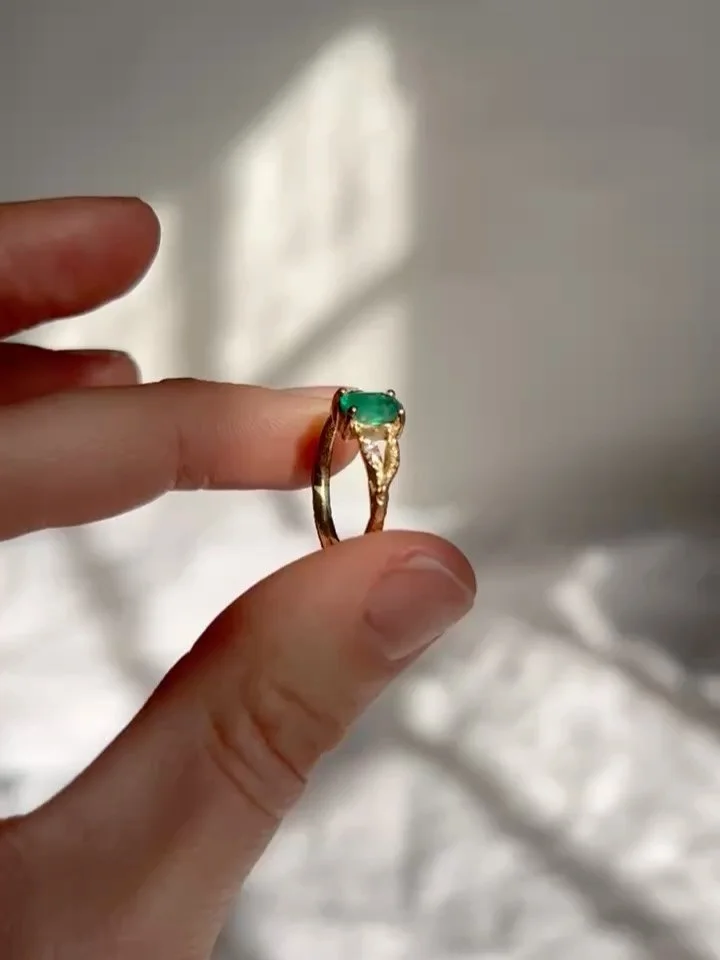 An oval emerald, set in a two pronged molten 18ct gold band 🤍 A beautiful one of a kind engagement ring, made for a beautiful one of a kind couple.