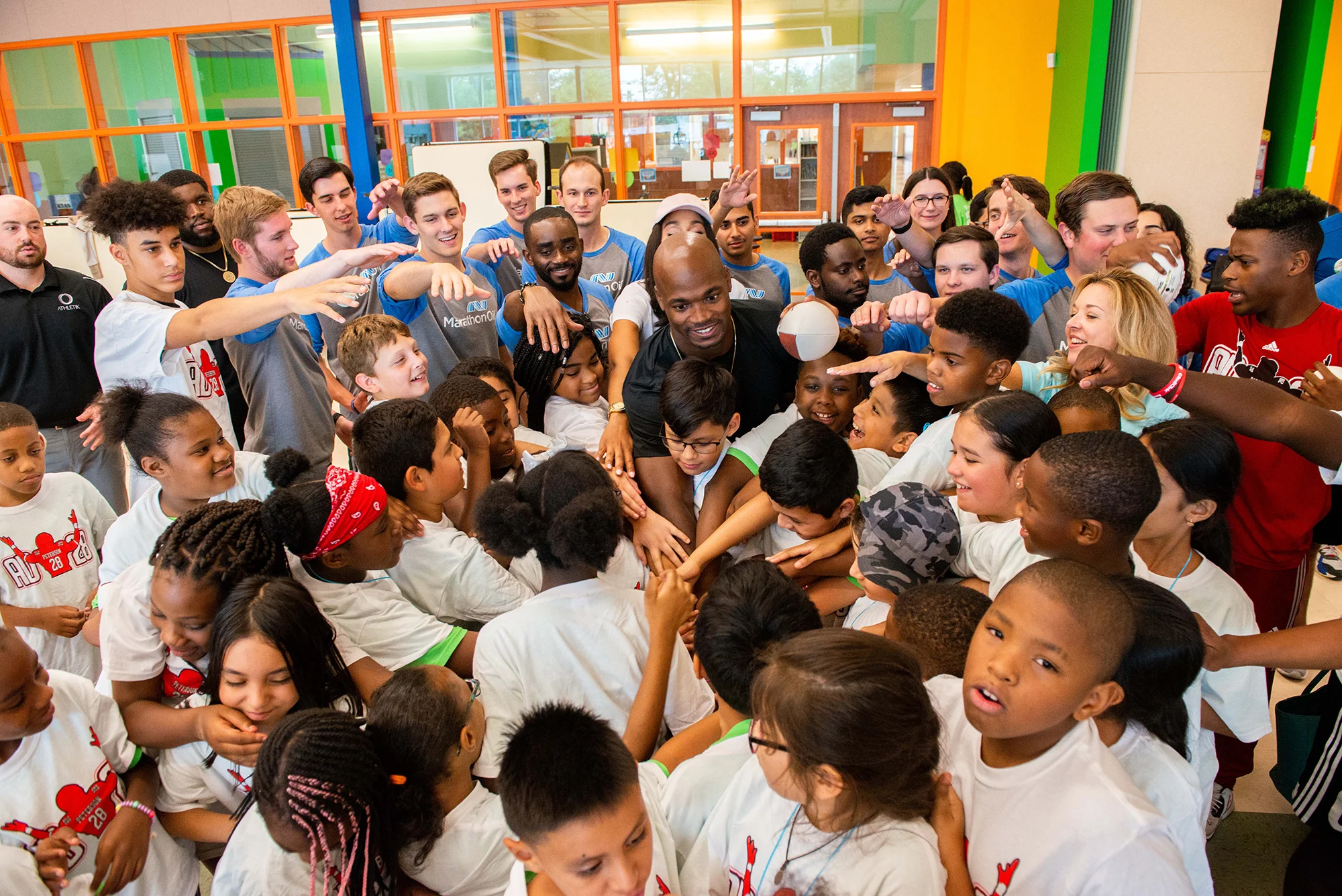 Adrian Peterson huddling up at Camp Adventure!; Photo by Michelle Watson.jpg