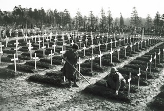 Tending graves at Abbeville, France, 1918