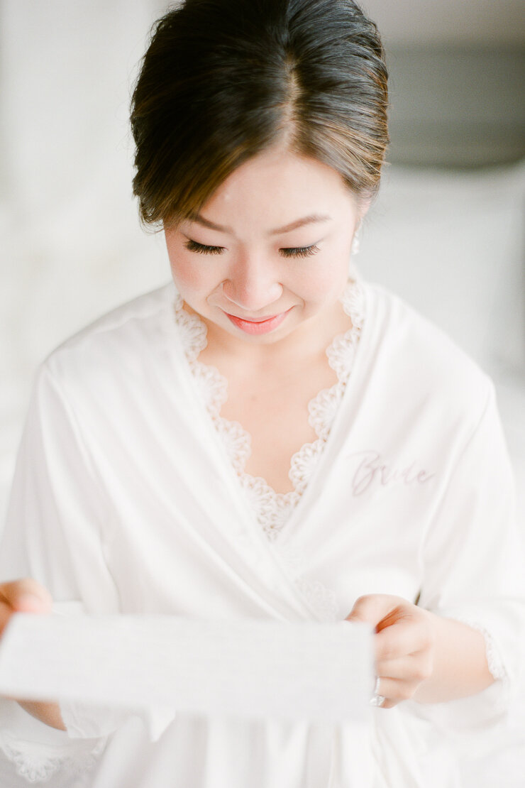 Bride Reading Groom's Letter on Wedding Day