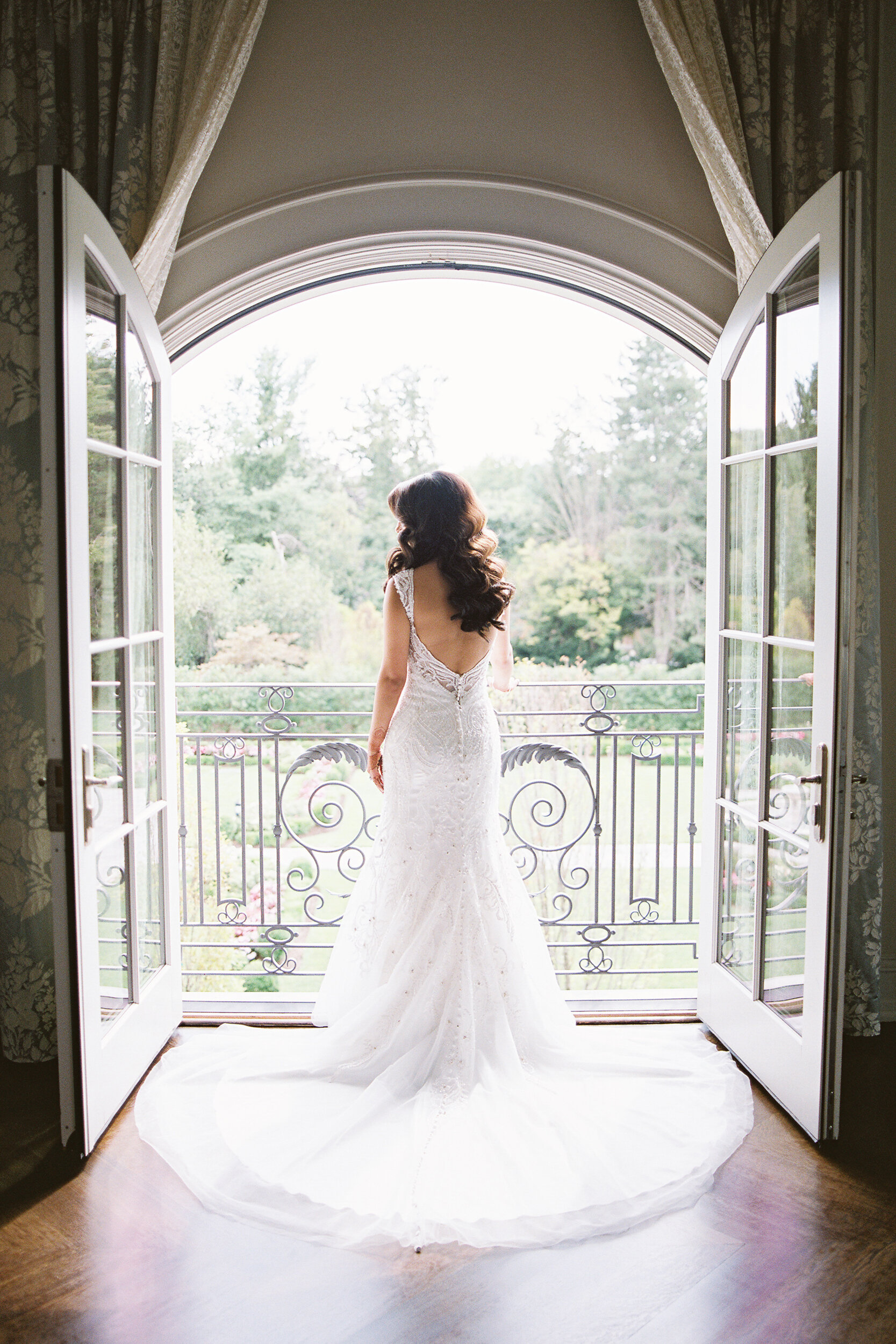 Bride Getting Ready overlooking the garden at The Park Chateau