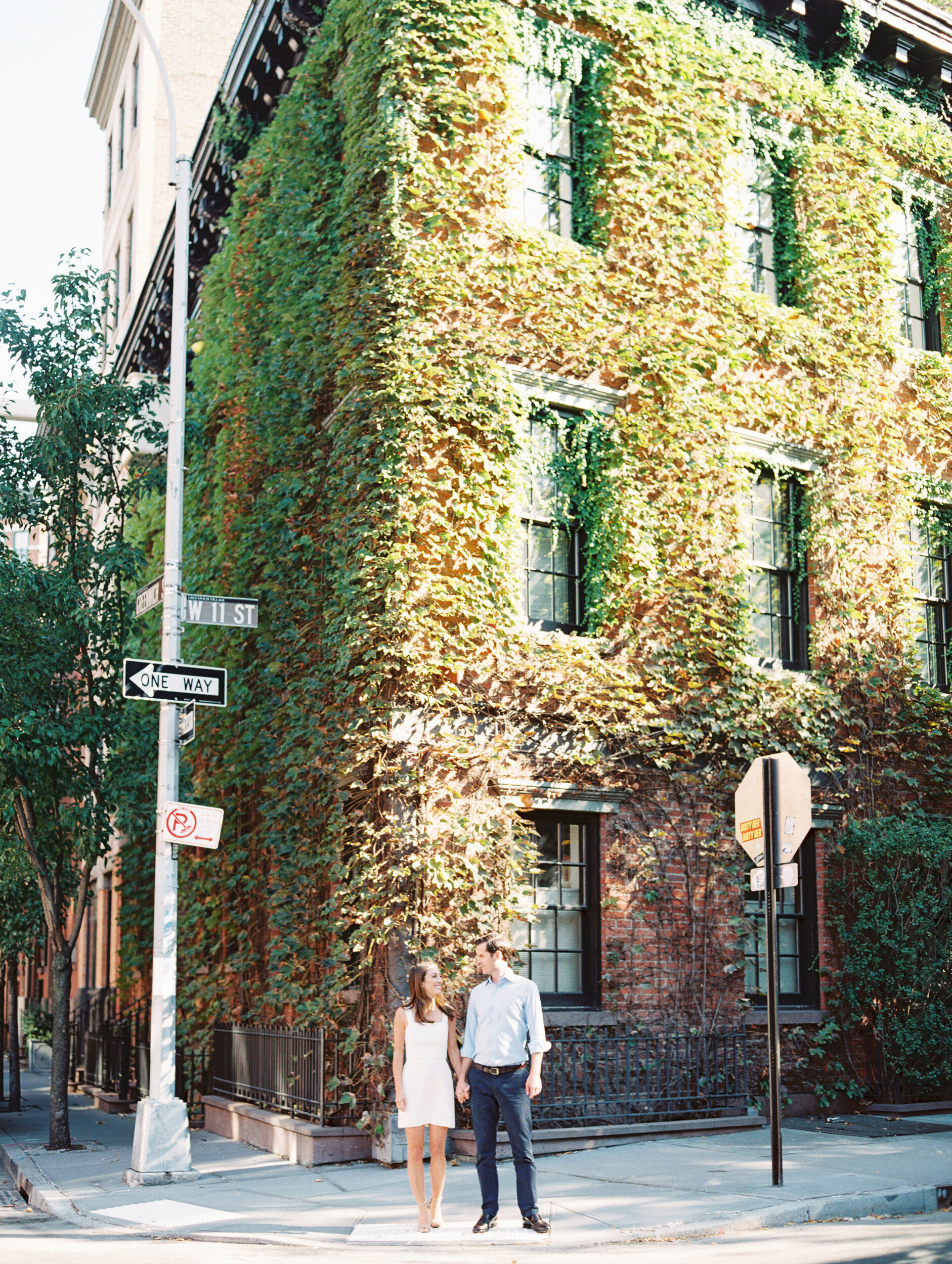 Ivy Covered Building in Background of Engagement Session Photos