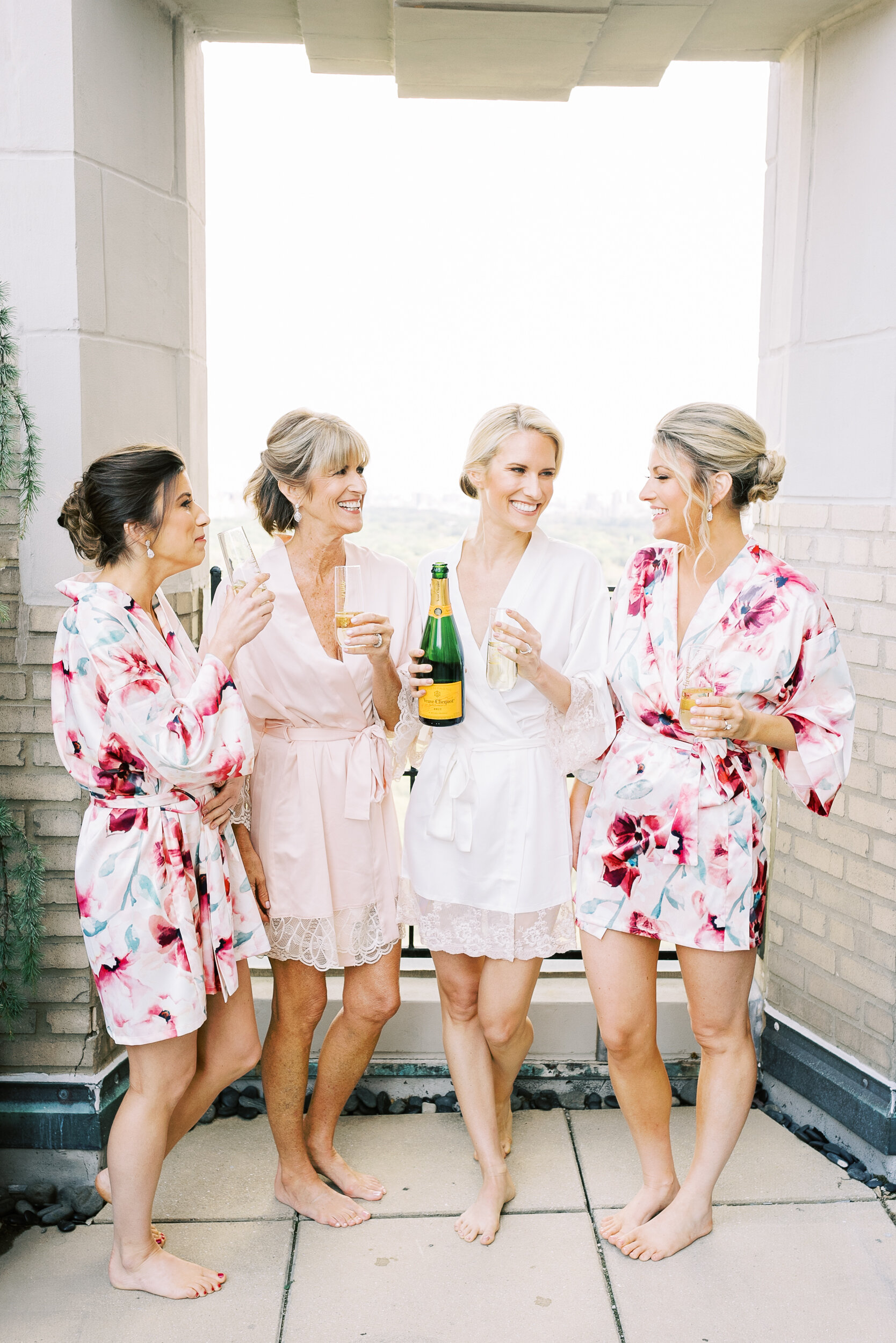 Bride, Bridesmaids, and Mother of the Bride Toasting the Wedding Day