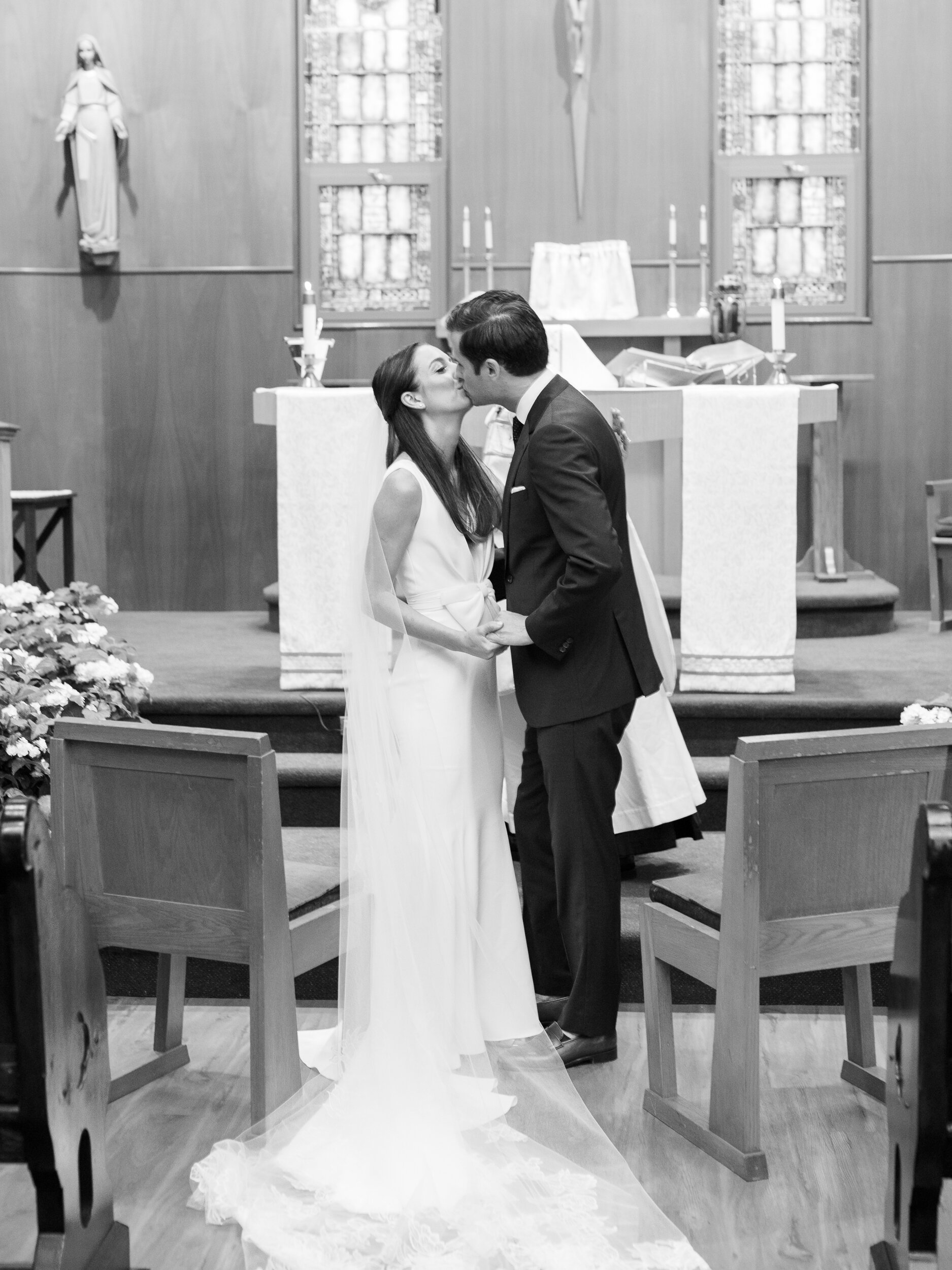 Bride and Groom Kiss at Church Ceremony in The Hamptons