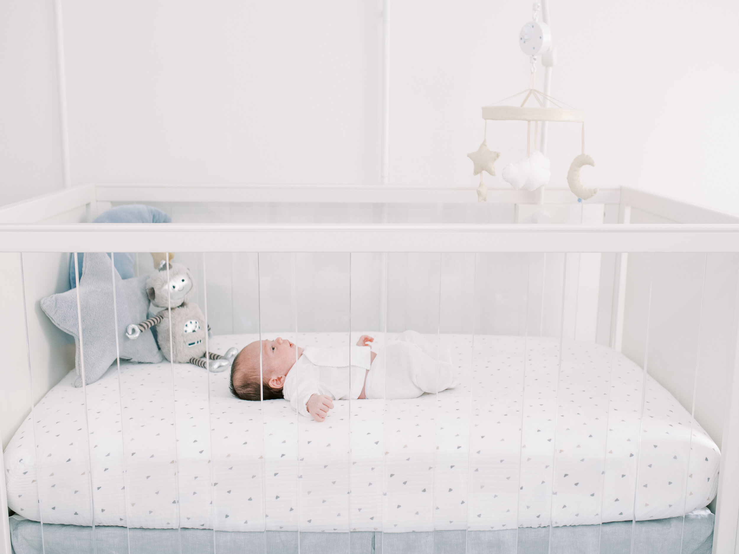 Baby in Crib in Nursery in New York City 