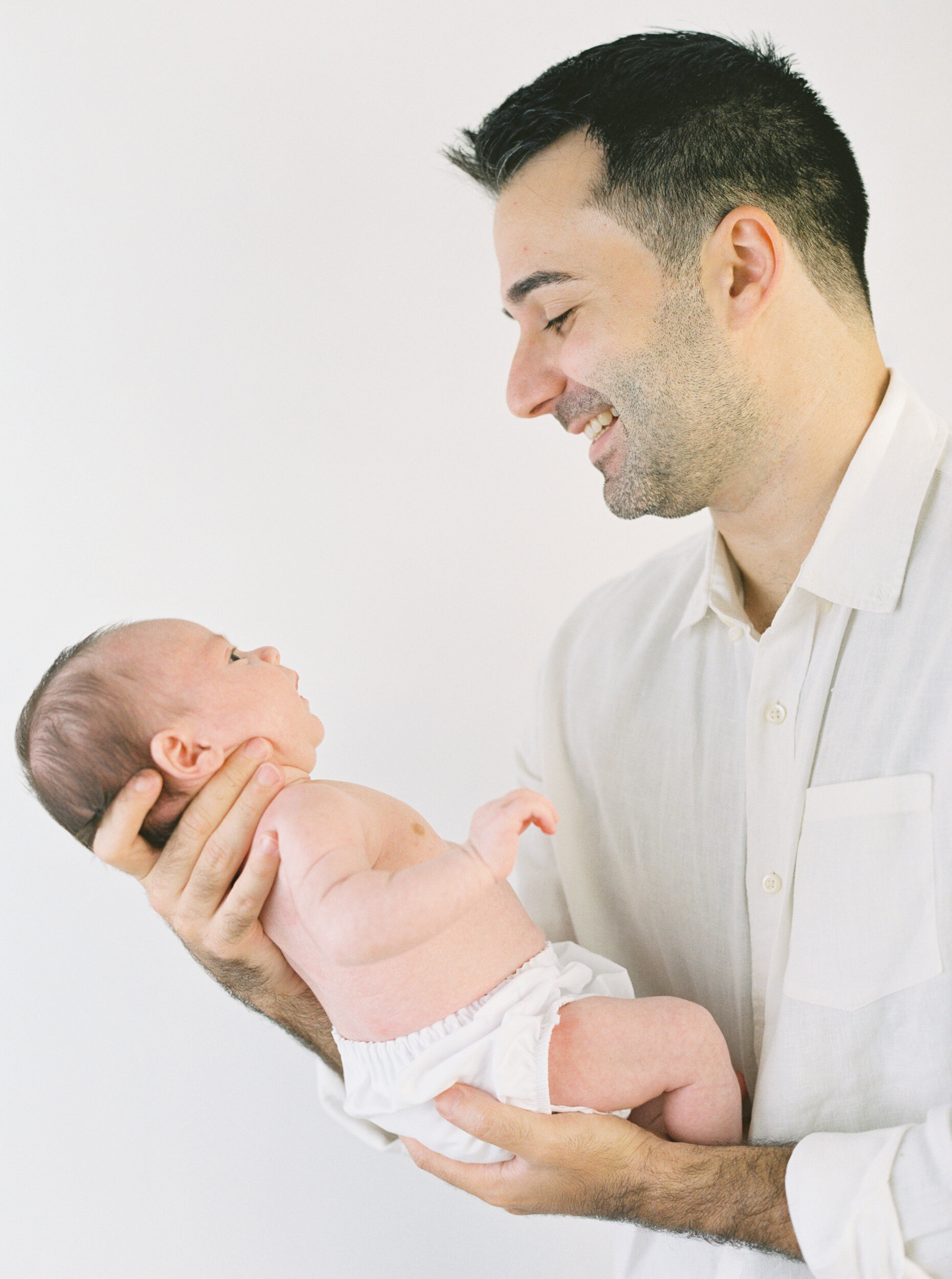 Dad holding newborn son, Newborn Photography in New York City 